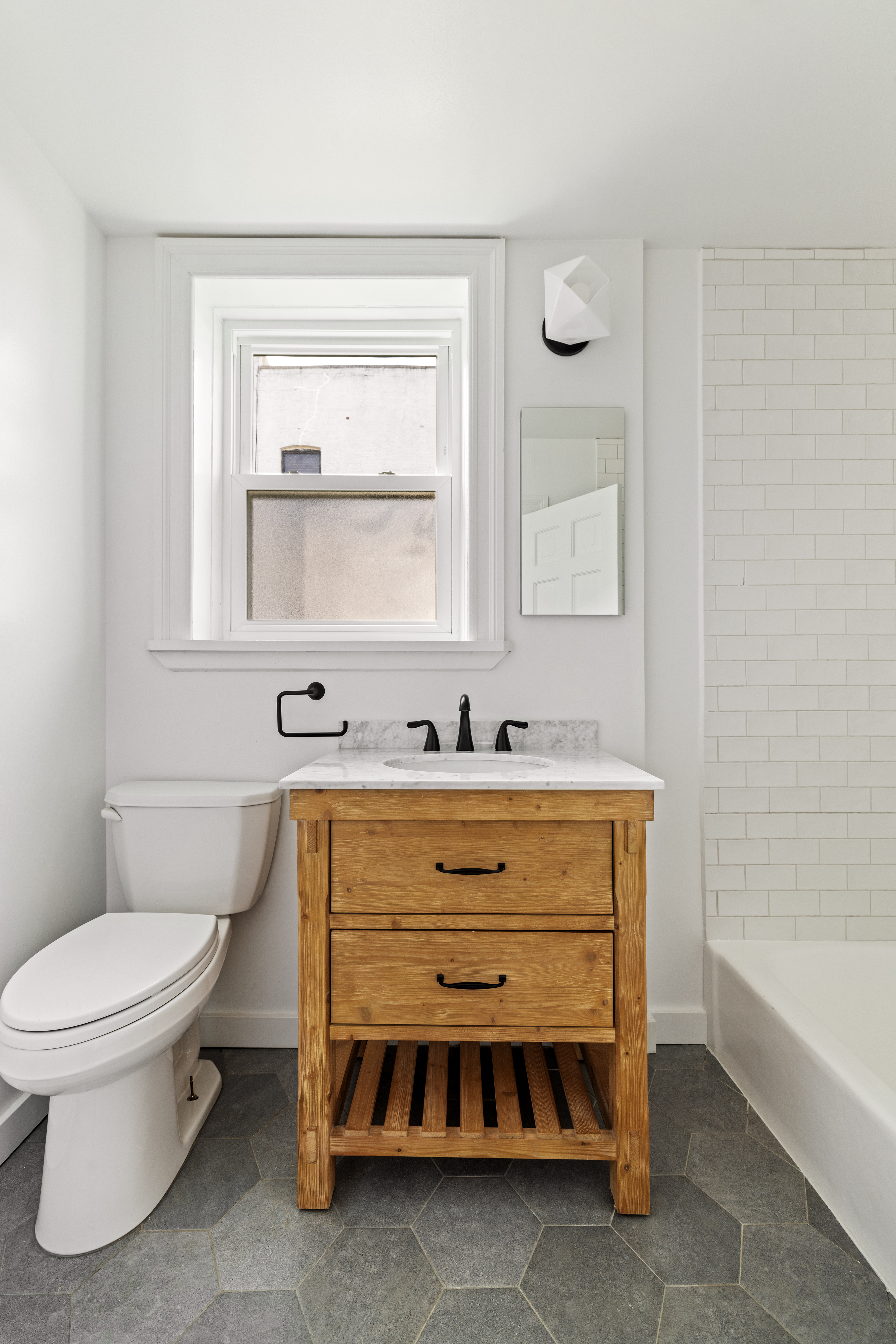 456 Prospect Avenue, Unit 3R Brooklyn, NY 11215 - Photo 15 of 16 a bathroom with a sink a toilet and a bathtub