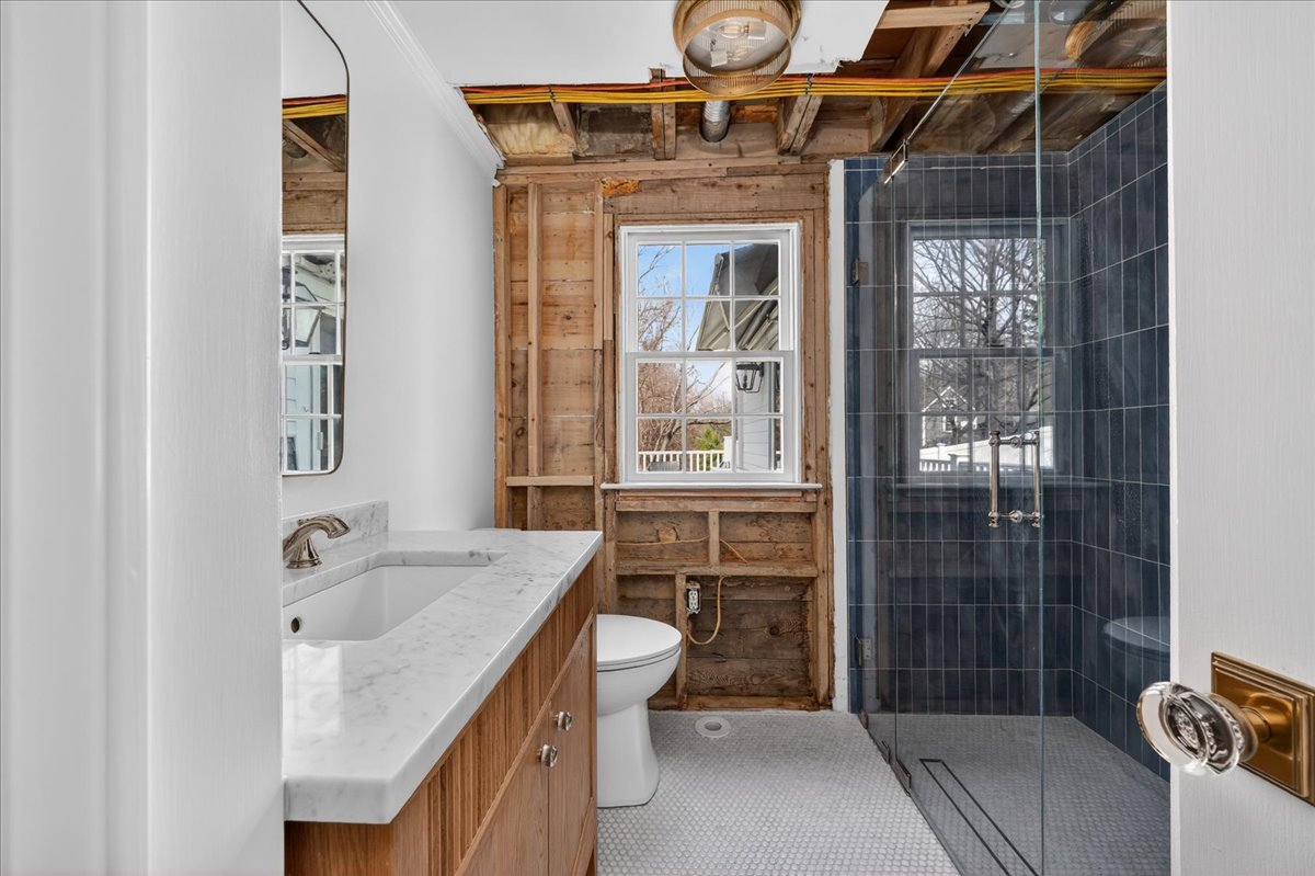 6 Studley Road Hingham, MA 02043 - Photo 13 of 27 a bathroom with a sink a toilet and shower