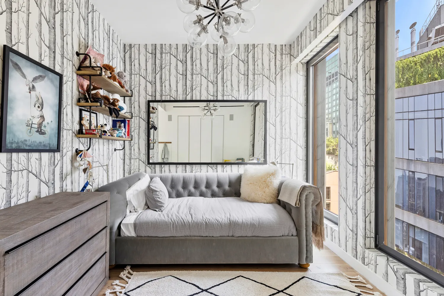 a bedroom with furniture and a large window