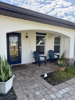 a view of a porch with seating space