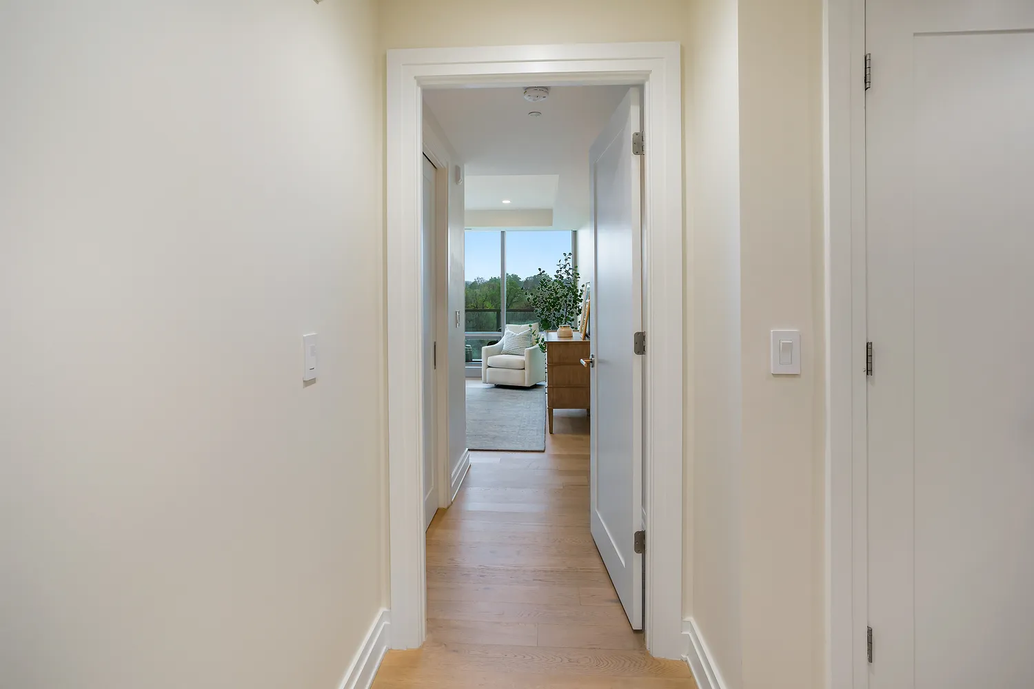 a bedroom with bed and a large window