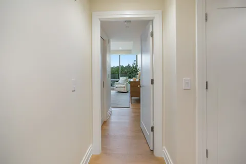 a bedroom with bed and a large window