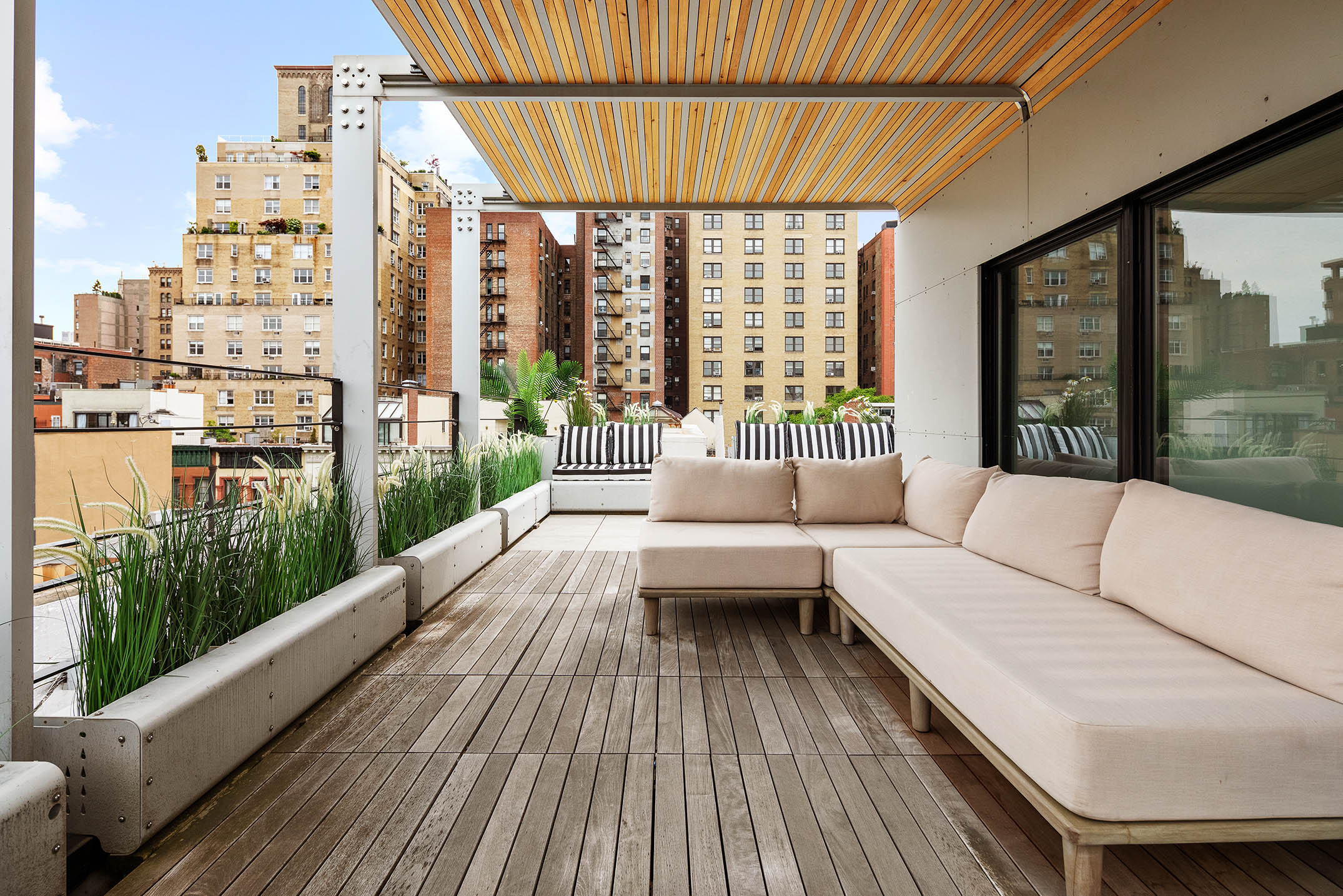 151 West 80th Street, Unit 5R Manhattan, NY 10024 - Photo 1 of 10 a balcony with furniture and large windows