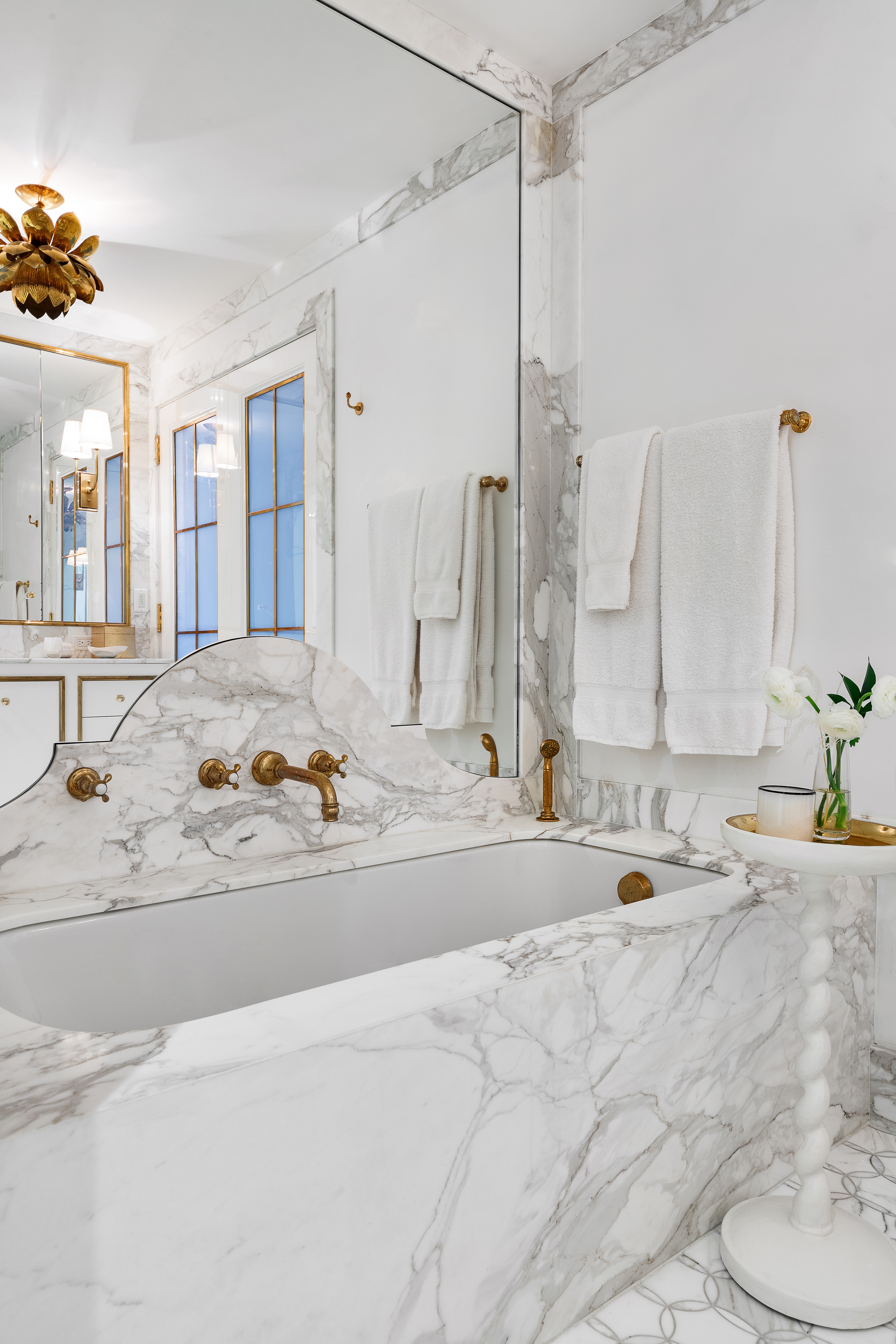 51 Jay Street, Unit PHB Brooklyn, NY 11201 - Photo 13 of 21 a view of a bathroom with a tub sink and mirror