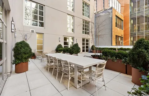 a view of a terrace with sitting area