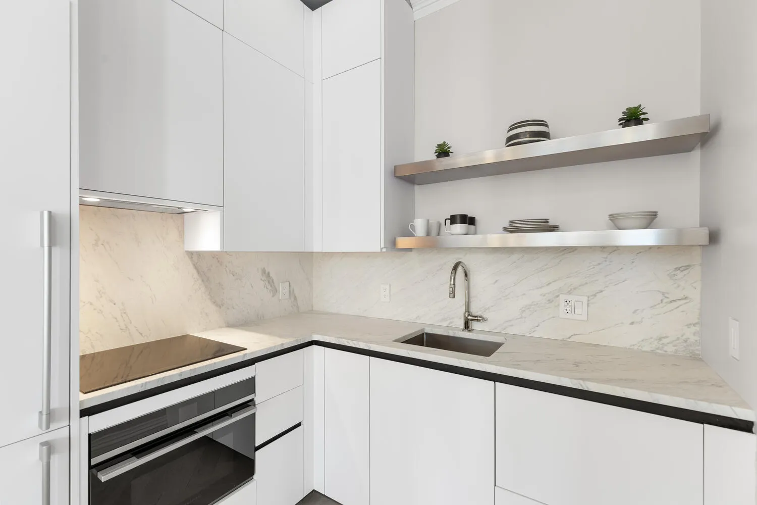 a kitchen with a sink and cabinets