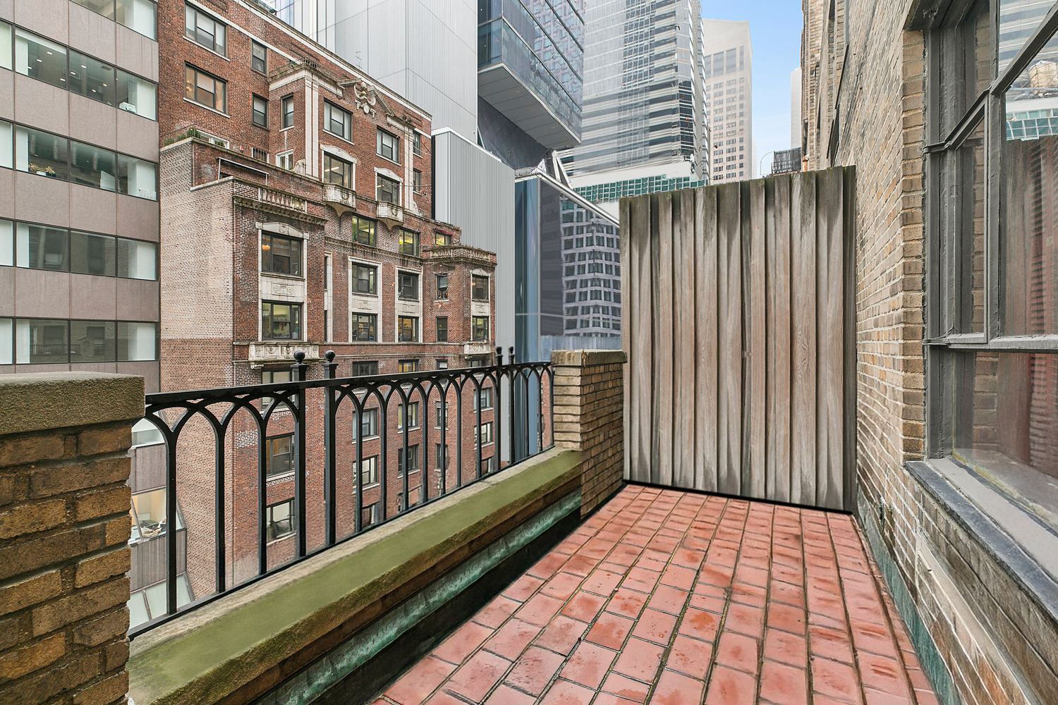 111 East 56th Street, Unit 1005 Manhattan, NY 10022 - Photo 2 of 9 a view of a balcony with wooden floor