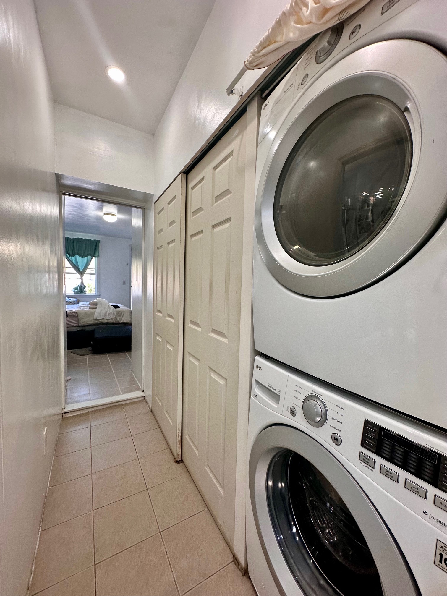 41-34 39th Street Queens, NY 11101 - Photo 8 of 10 a view of a hallway with washer and dryer