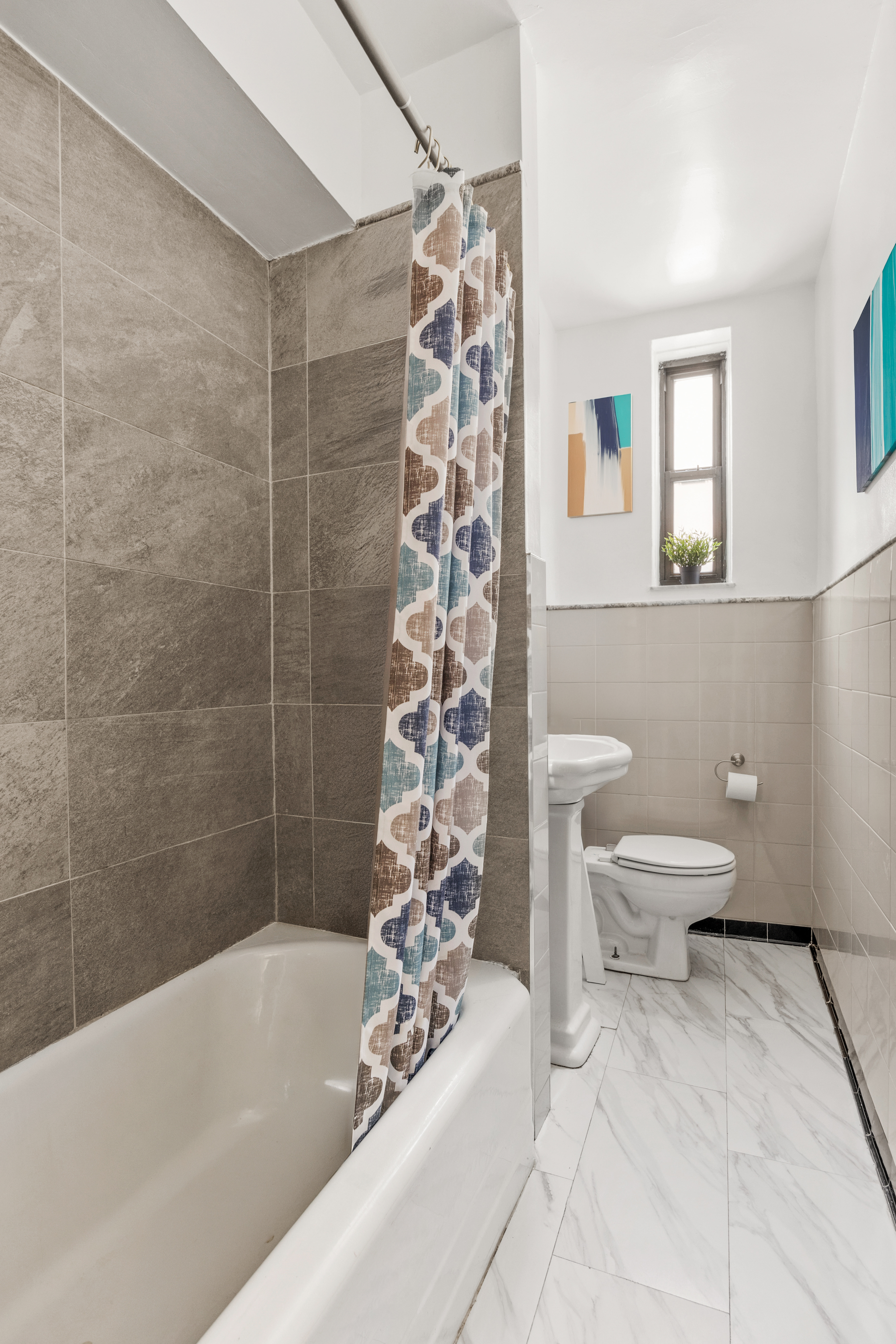 345 Webster Avenue, Unit 1B Brooklyn, NY 11230 - Photo 6 of 13 a bathroom with a bathtub and shower
