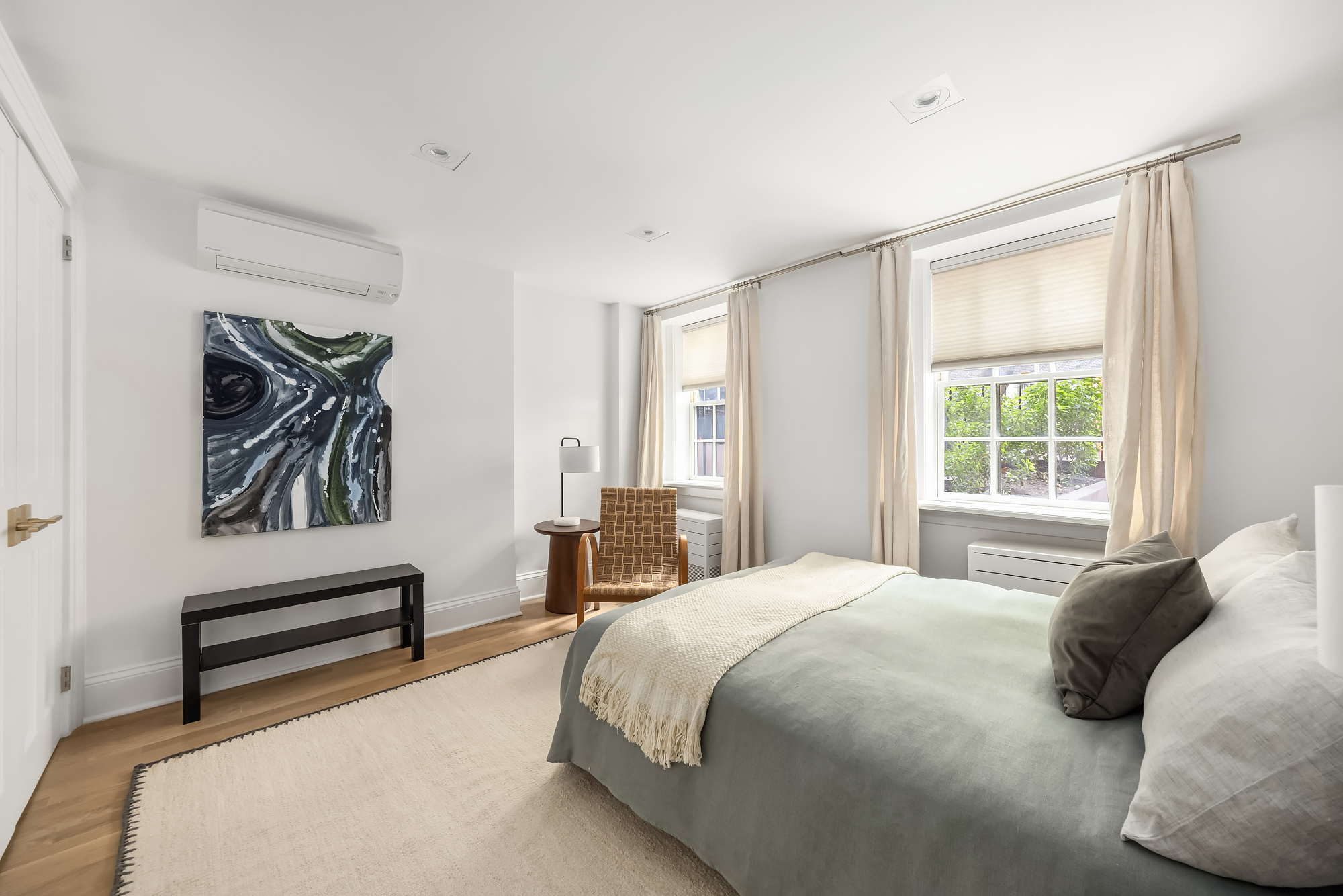 112 West 13th Street Manhattan, NY 10011 - Photo 44 of 46 a bedroom with a bed and a window