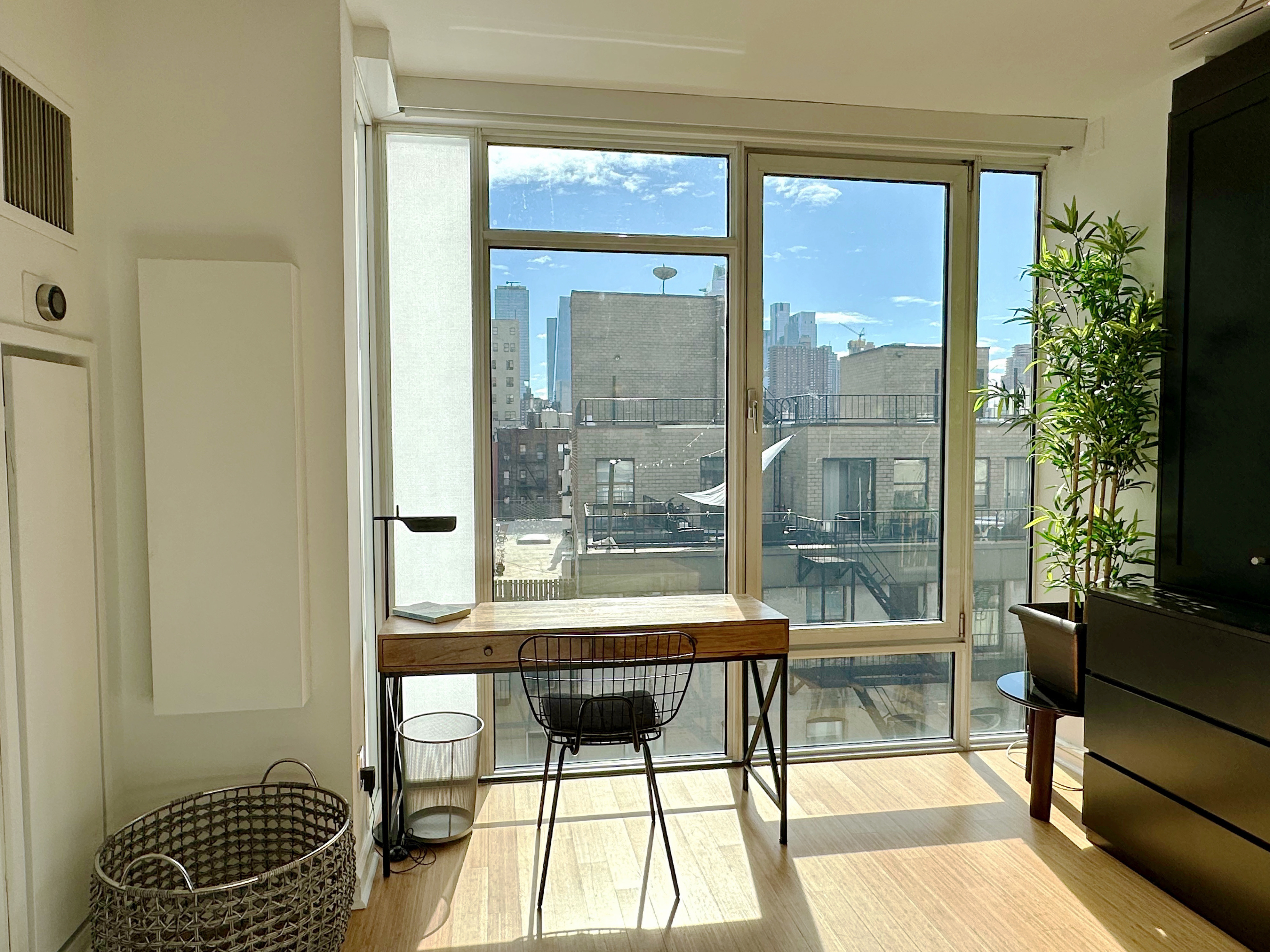 350 West 53rd Street, Unit PHA Manhattan, NY 10019 - Photo 12 of 35 a room with furniture and a window