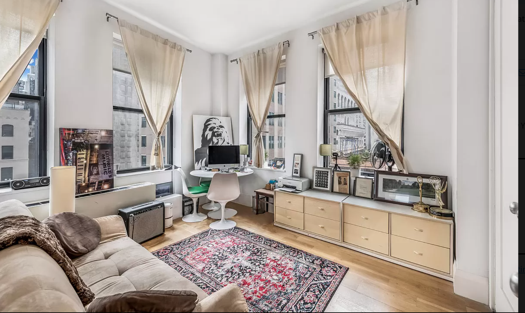 71 Nassau Street, Unit 12C Manhattan, NY 10038 - Photo 10 of 18 a living room with furniture and a large window