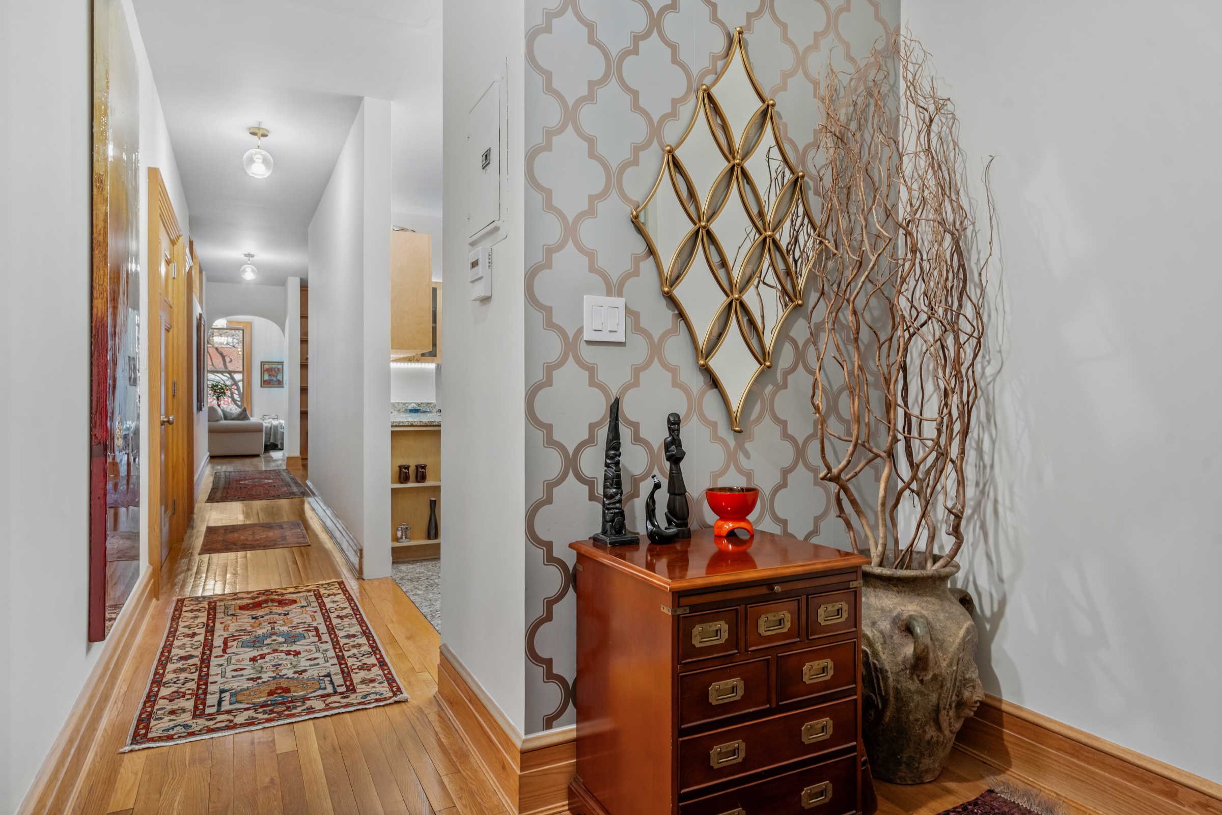 300 West 109th Street, Unit 2JK Manhattan, NY 10025 - Photo 6 of 18 a view of a hallway with wooden floor and furniture