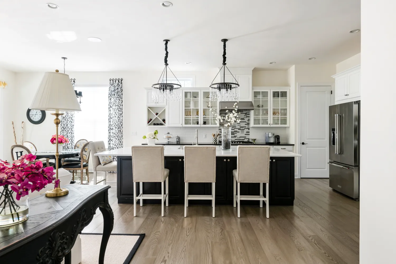 a dining room with stainless steel appliances kitchen island granite countertop furniture and a kitchen view