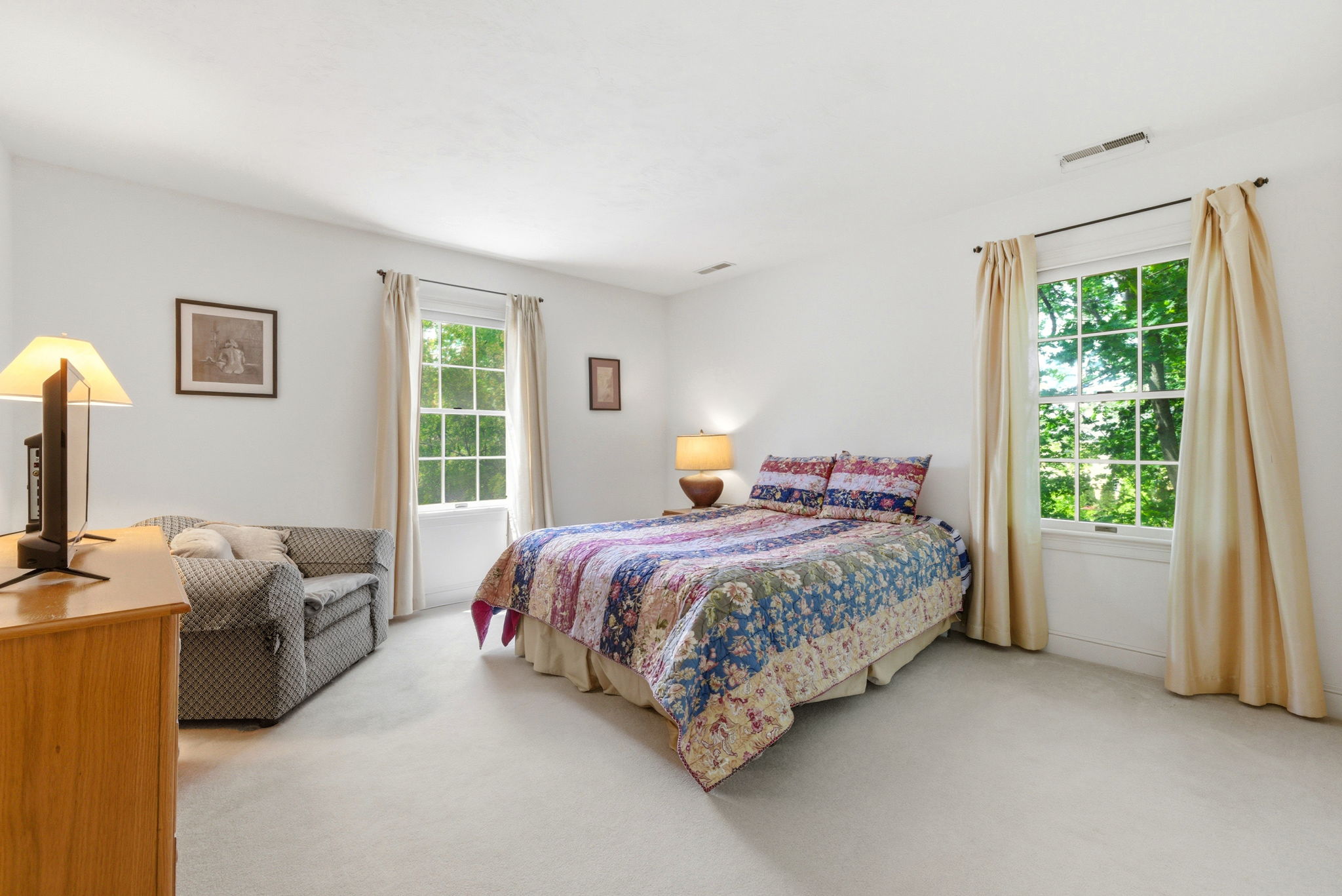 2 Laurel Street Lexington, MA 02421 - Photo 33 of 46 a bedroom with a bed table chair and a window