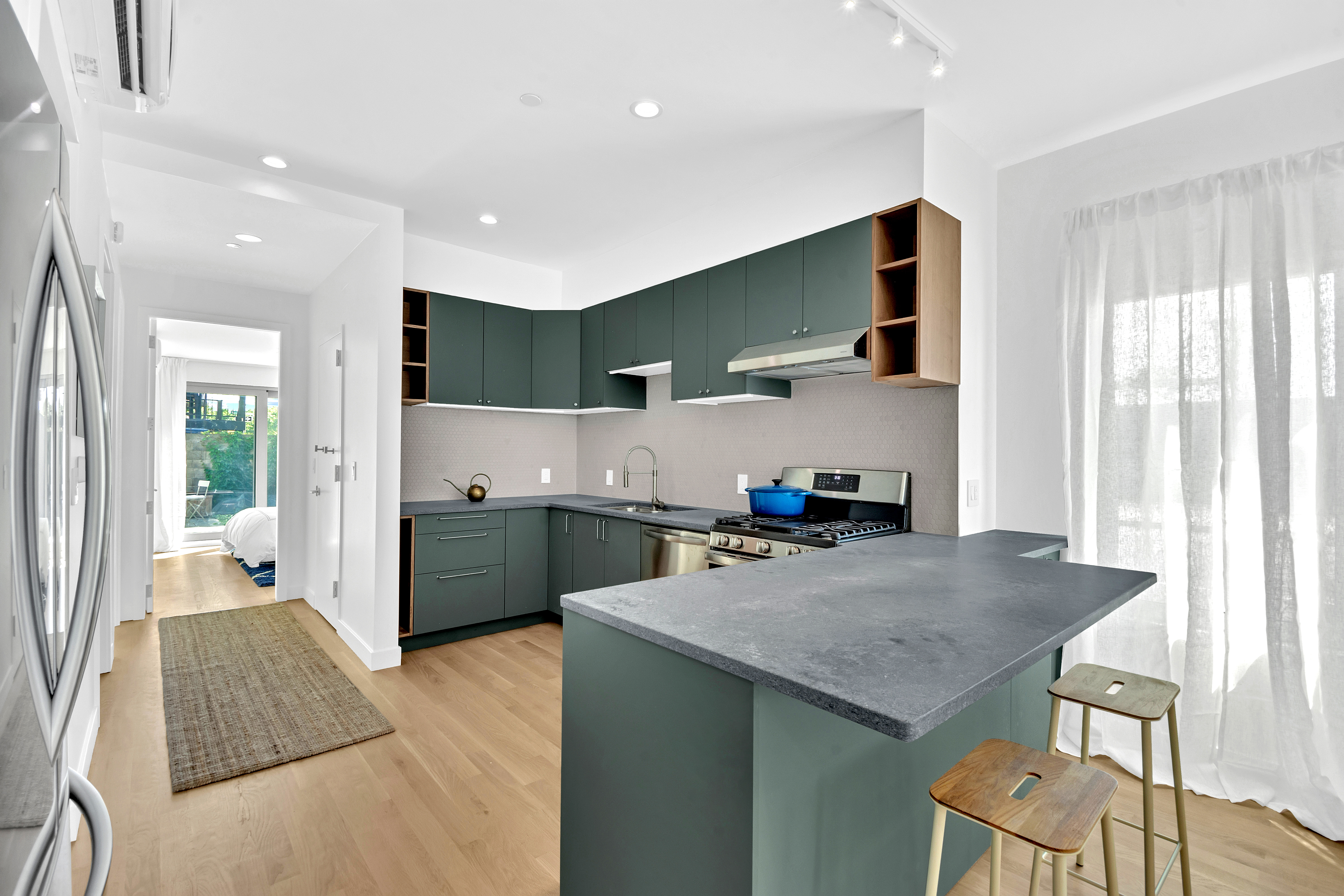 86 Baltic Street, Unit 1 Brooklyn, NY 11201 - Photo 4 of 14 a kitchen with stainless steel appliances granite countertop a sink a stove and a refrigerator