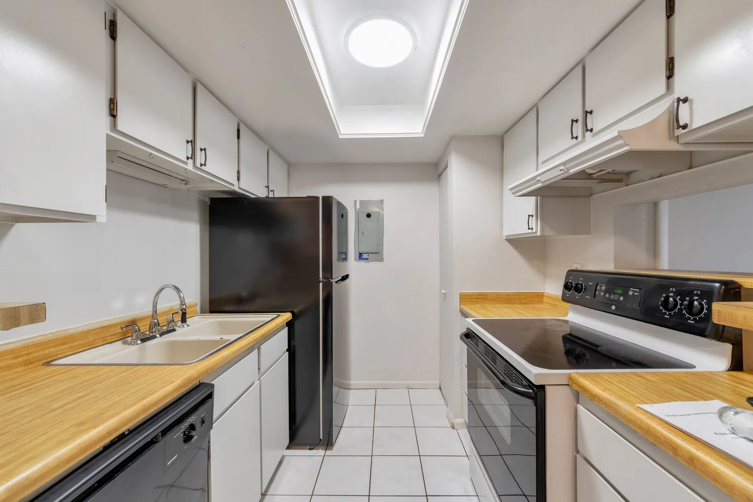 a kitchen that has a sink and a stove