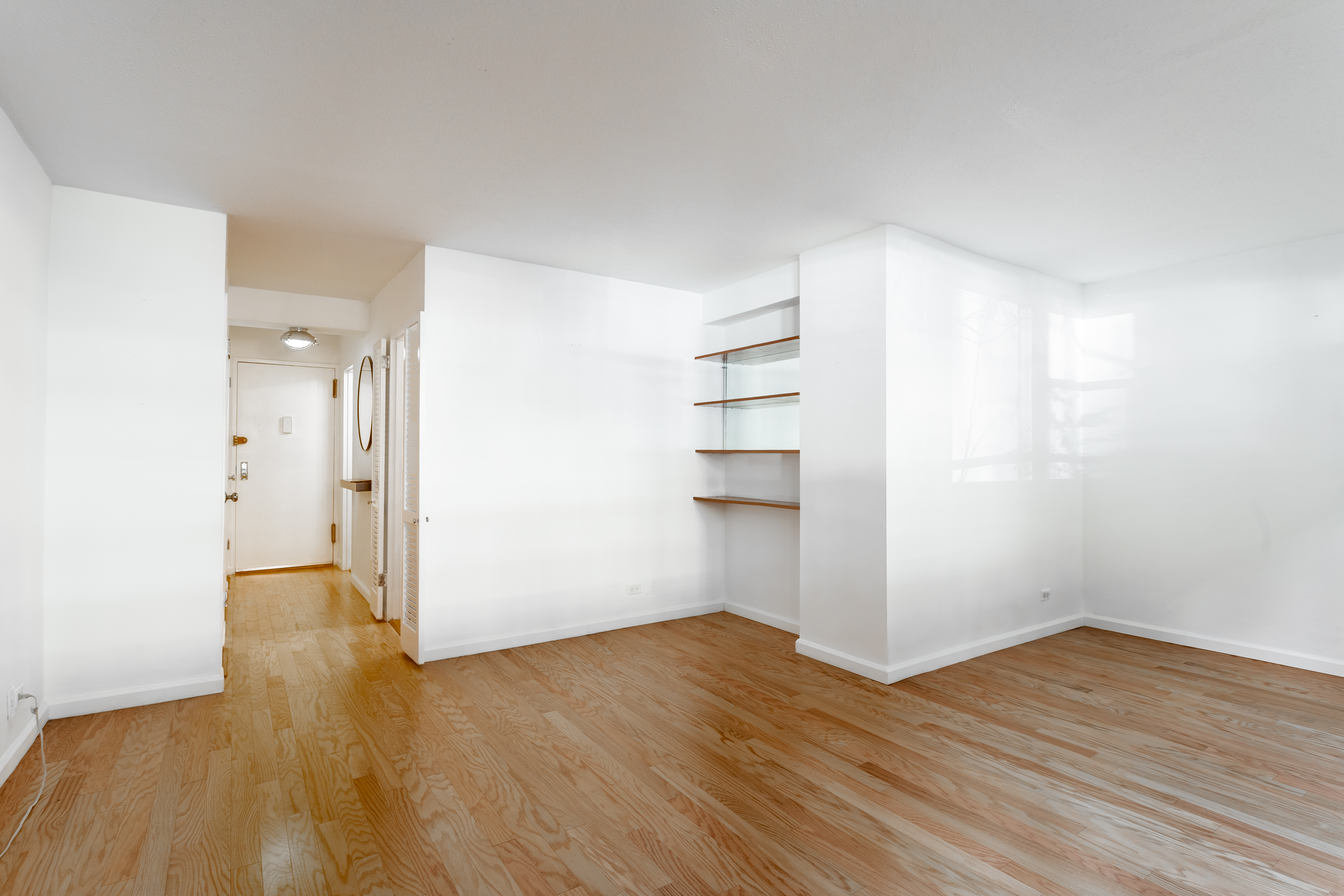 520 East 81st Street, Unit 1F Manhattan, NY 10028 - Photo 5 of 8 a view of empty room with wooden floor