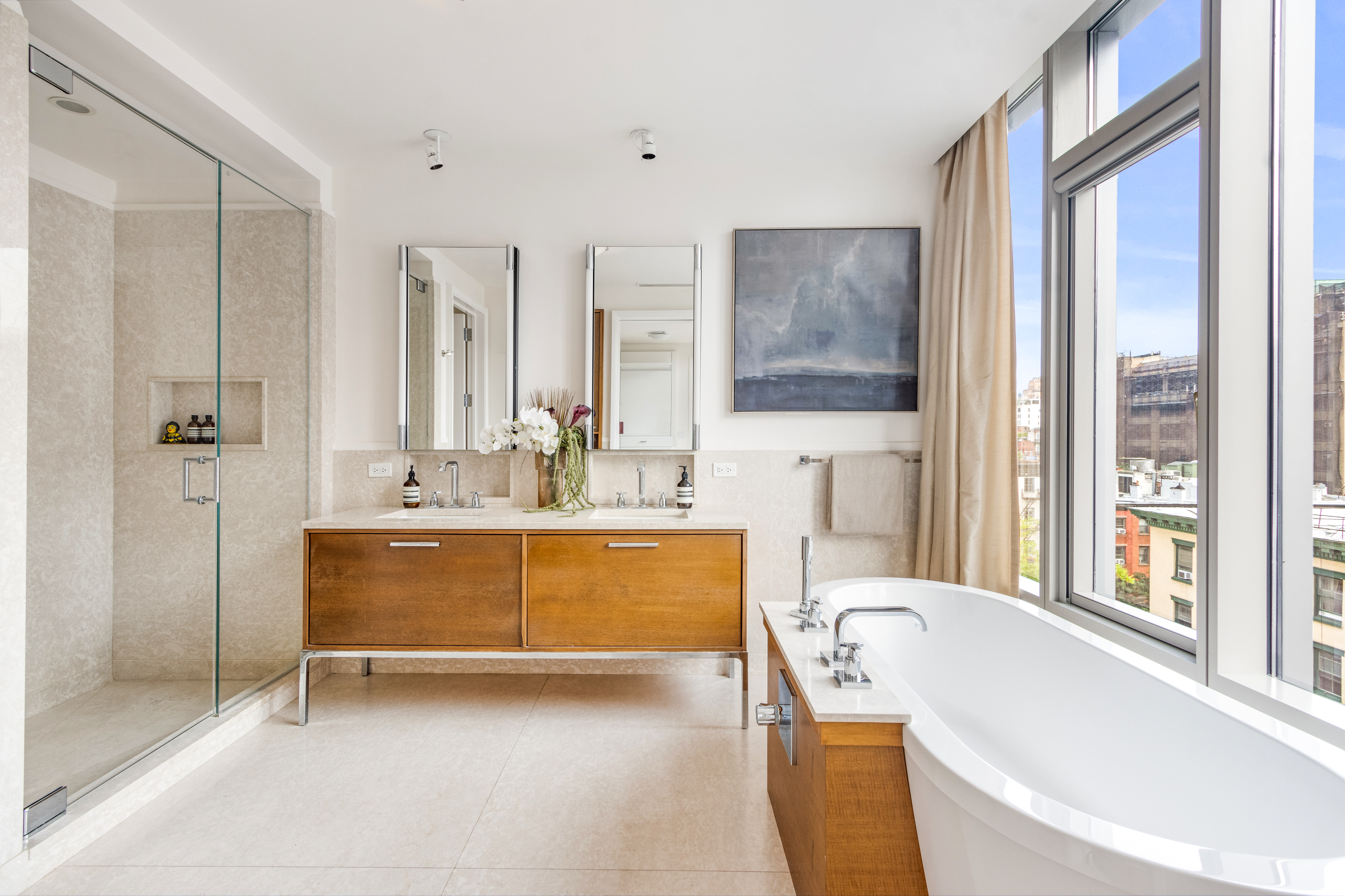 177 9th Avenue, Unit PHA Manhattan, NY 10011 - Photo 12 of 28 a bathroom with a tub sink and mirror
