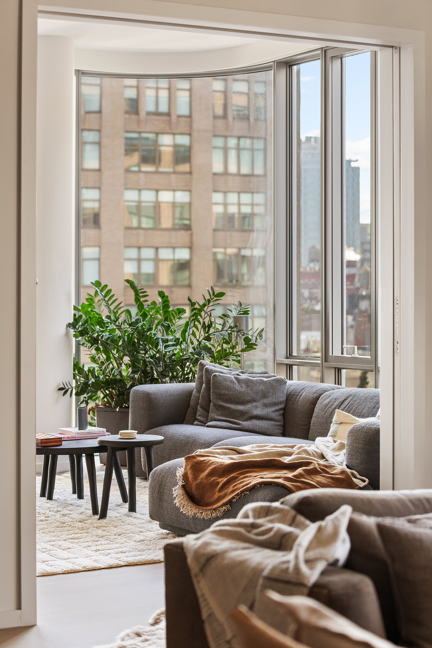565 Broome Street, Unit S11E Manhattan, NY 10013 - Photo 4 of 11 a living room with furniture and a large window