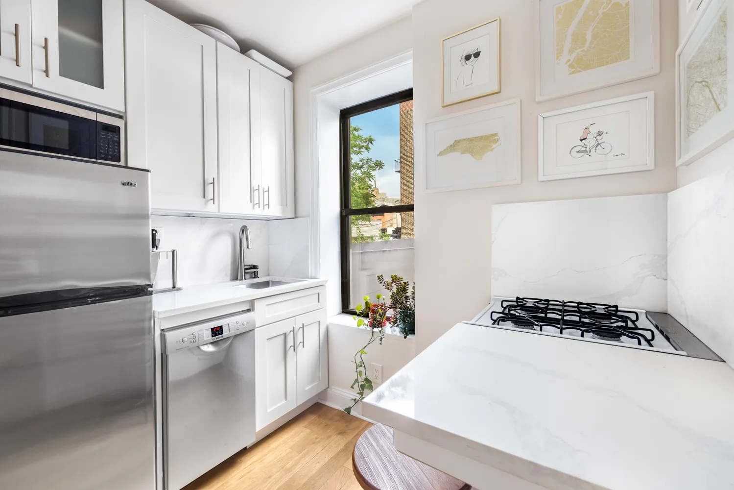 a kitchen with a white stove top oven and sink