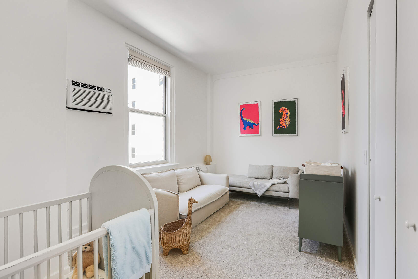 35 East 12th Street, Unit 8C Manhattan, NY 10003 - Photo 12 of 22 a living room with furniture and a window