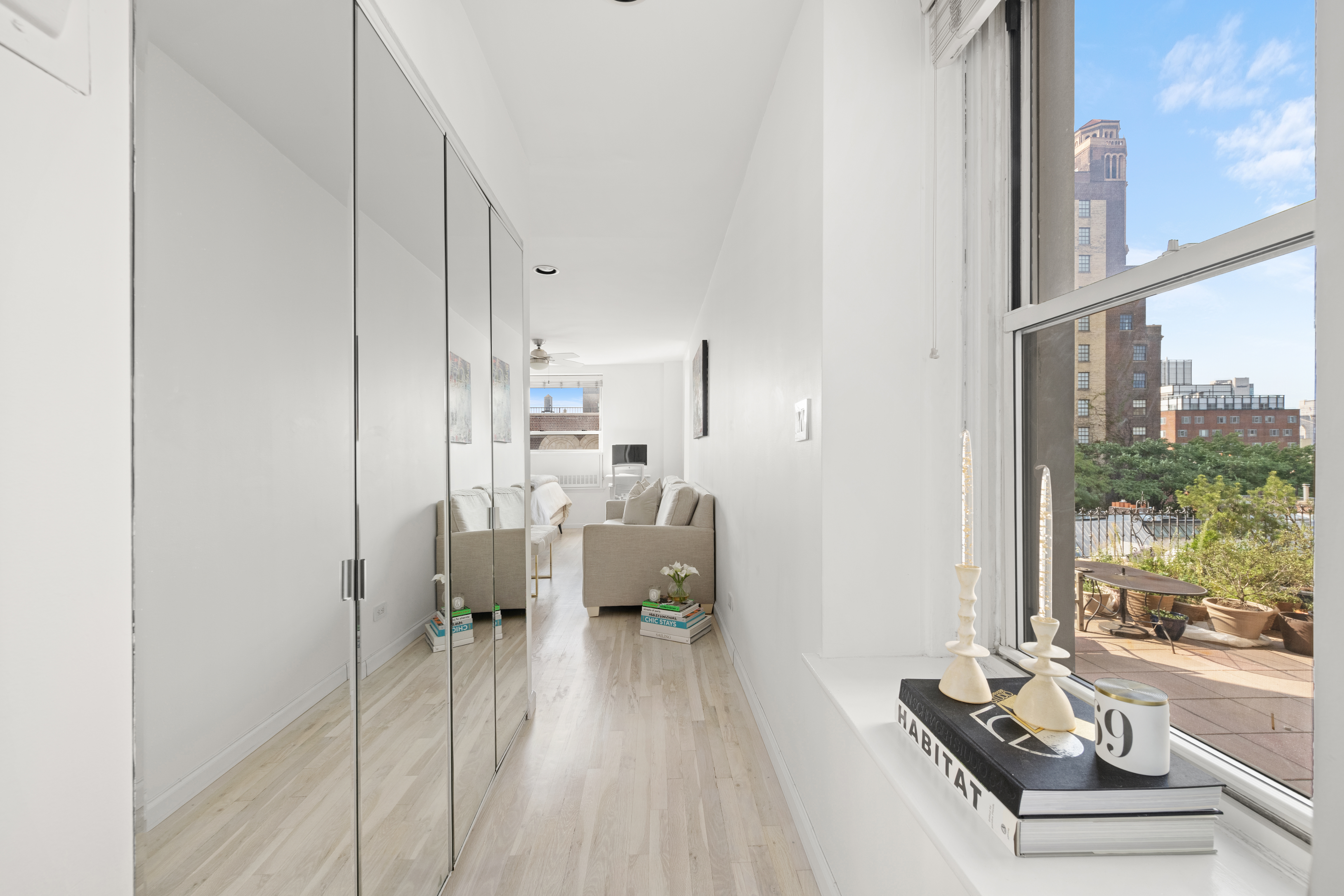 111 Hicks Street, Unit 6E Brooklyn, NY 11201 - Photo 7 of 11 a living room with furniture and a large window