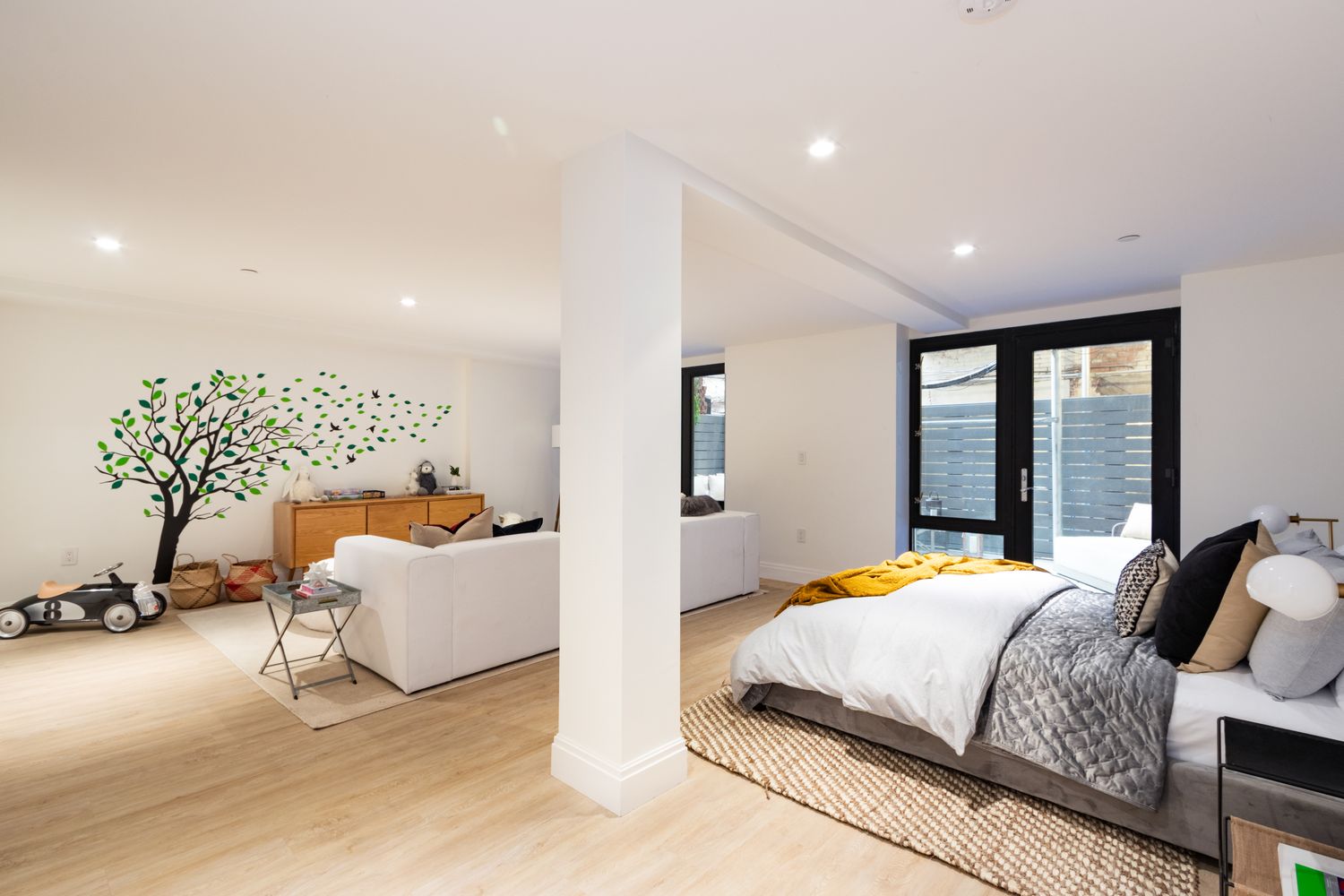 106 Franklin Street, Unit MAIS Manhattan, NY 10013 - Photo 6 of 16 a bedroom with a bed and large windows