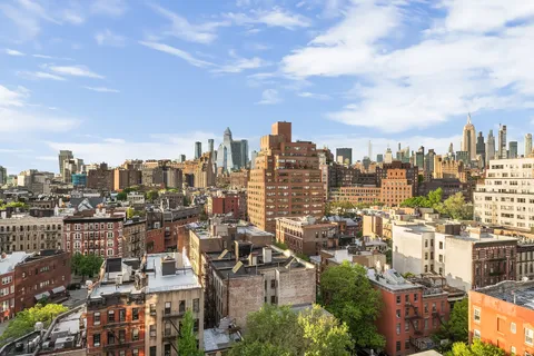 a view of a city with tall buildings