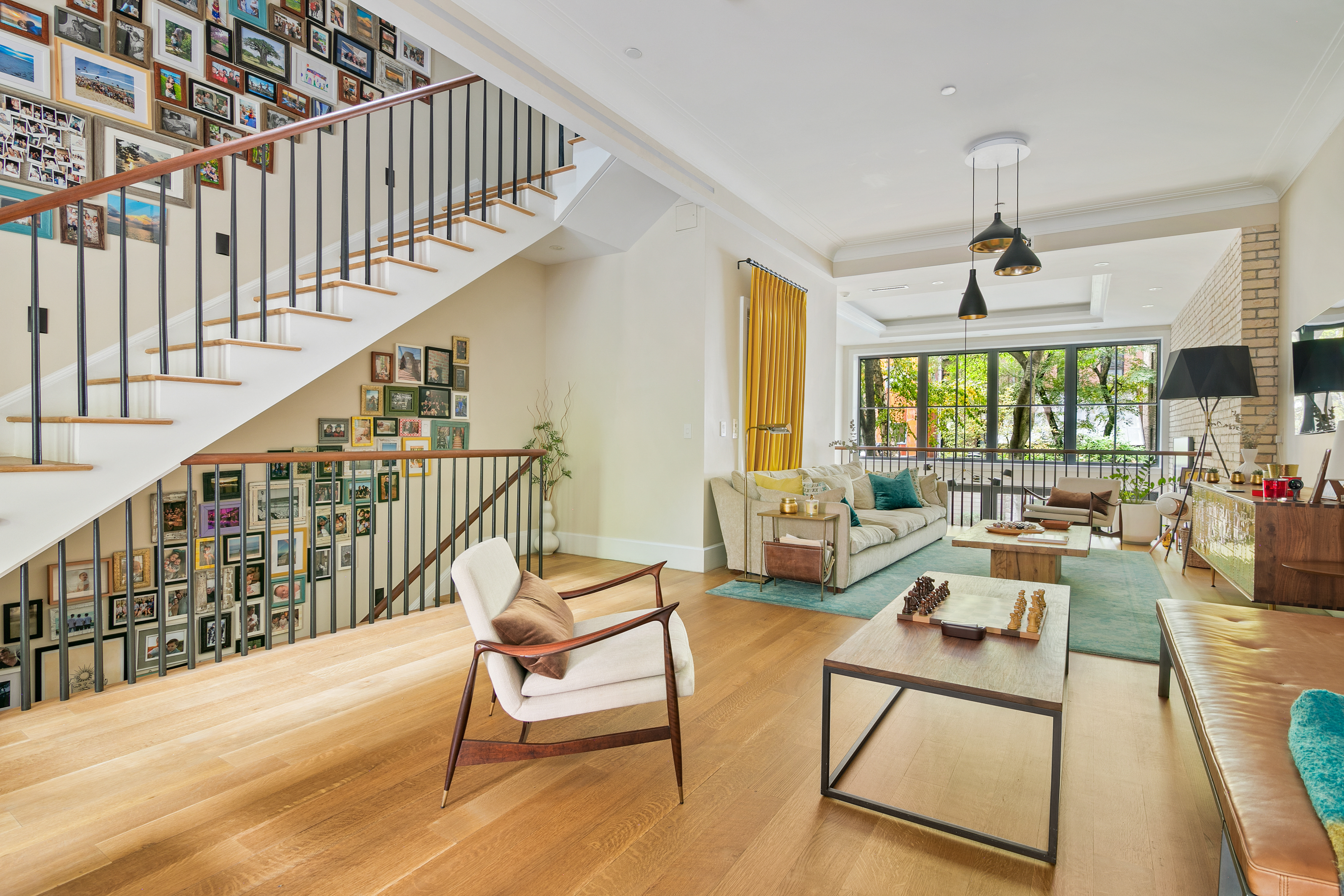 152 West 13th Street Manhattan, NY 10011 - Photo 12 of 28 a living room with lots of furniture and a large window