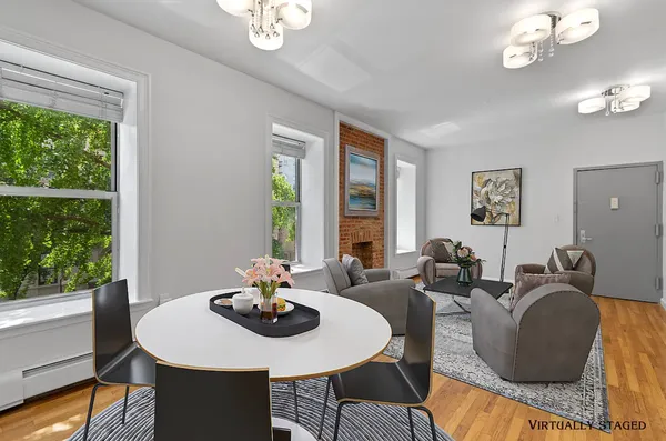 a view of a dining room with furniture window and outside view