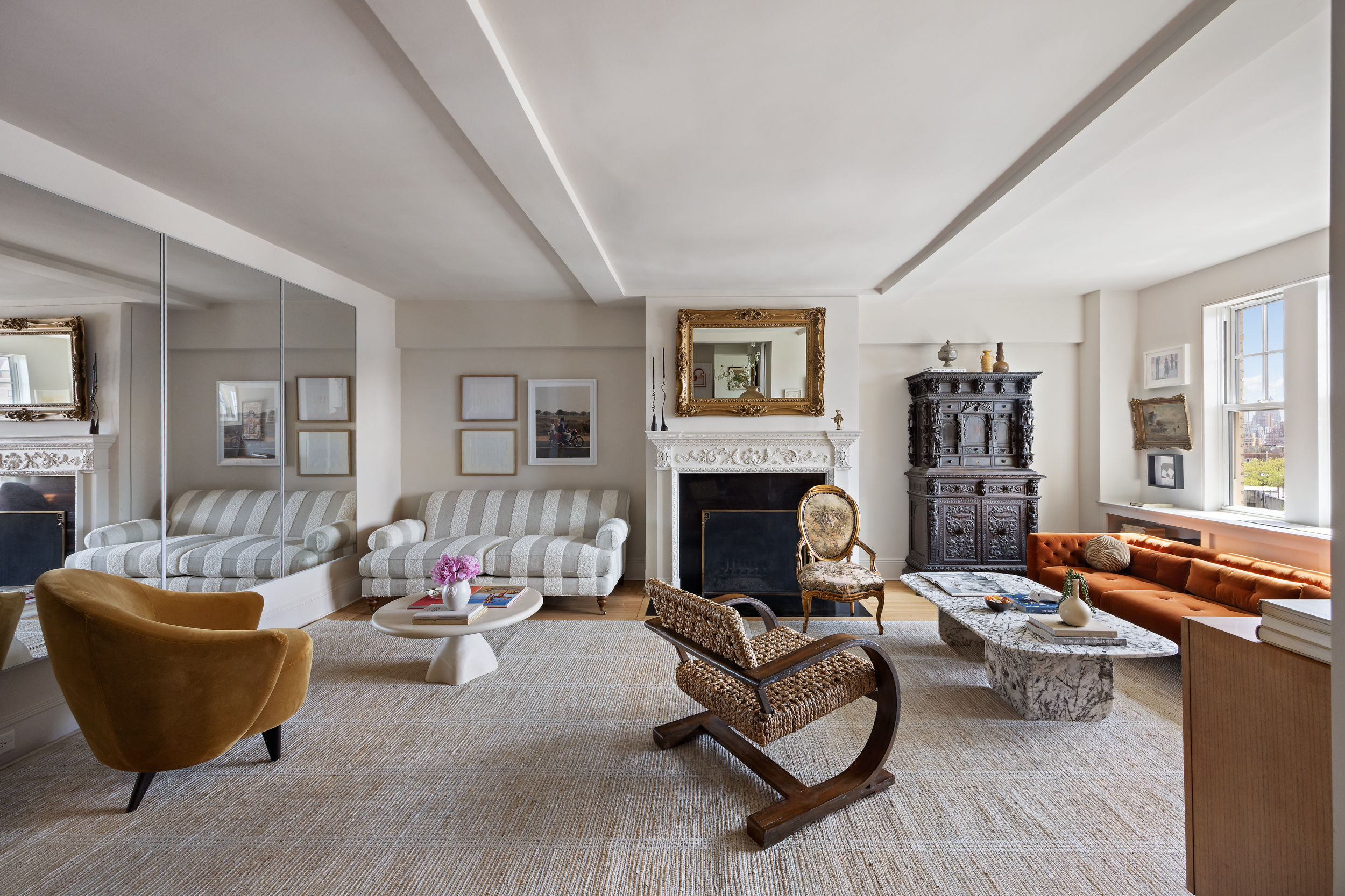 302 West 12th Street, Unit 11F Manhattan, NY 10014 - Photo 2 of 17 a living room with furniture and a fireplace