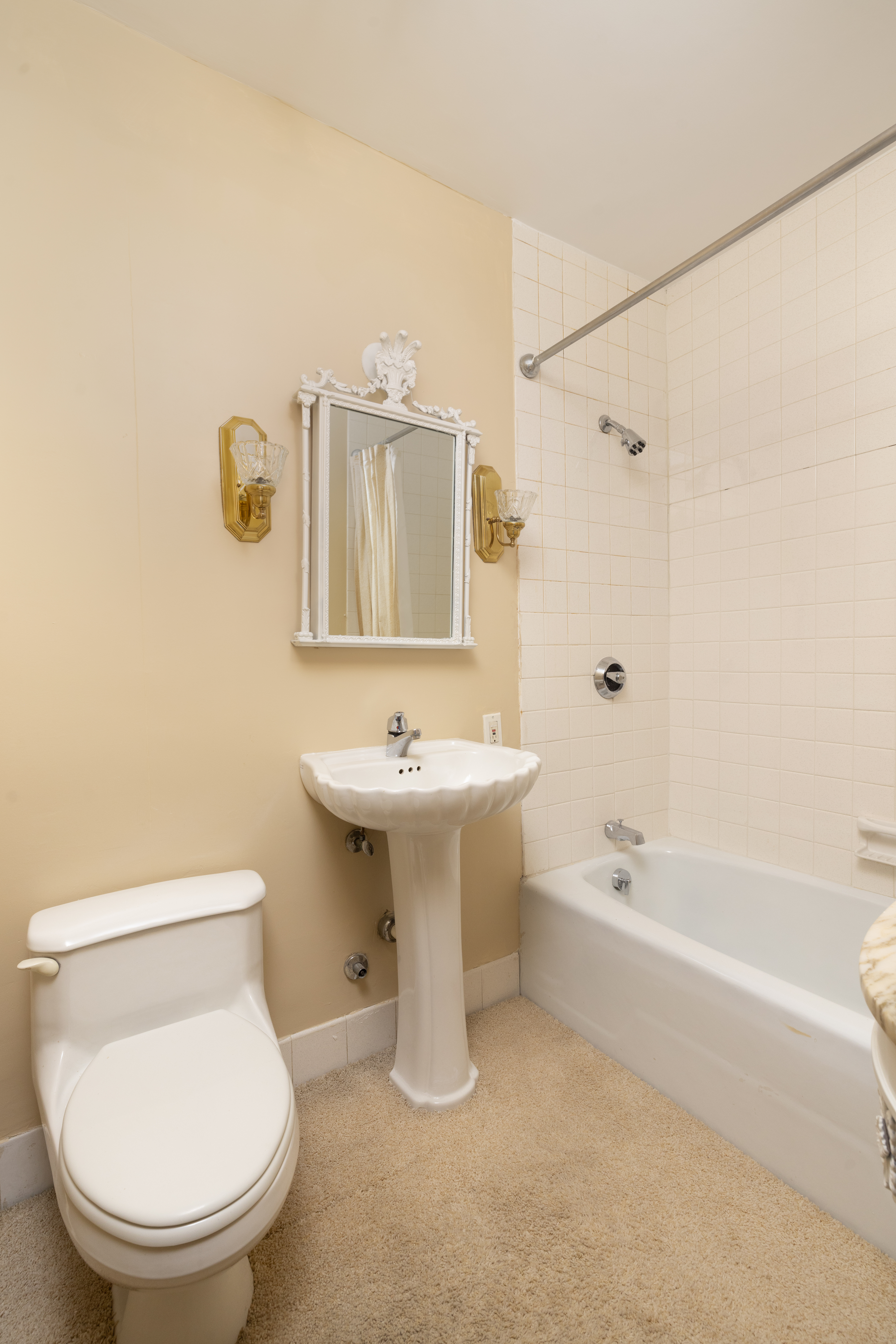 20 West 64th Street, Unit 41H Manhattan, NY 10023 - Photo 12 of 39 a bathroom with a sink a toilet and bathtub