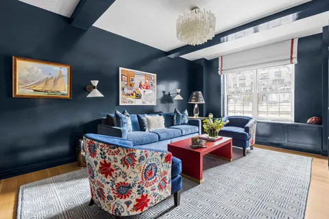a living room with fireplace furniture and a flat screen tv