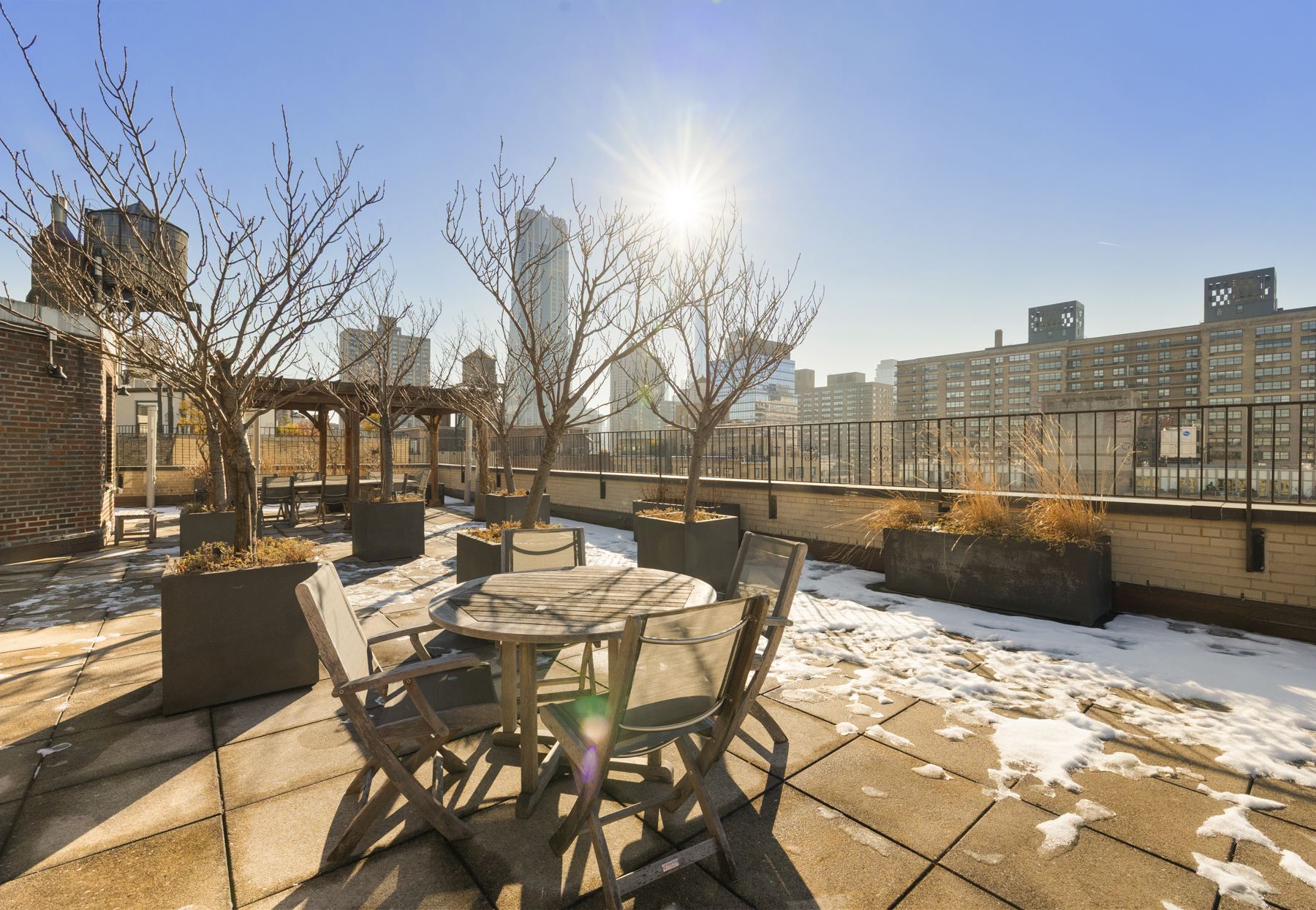 322 West 72nd Street, Unit 3D Manhattan, NY 10023 - Photo 13 of 19 a view of a roof deck with couches and wooden floor