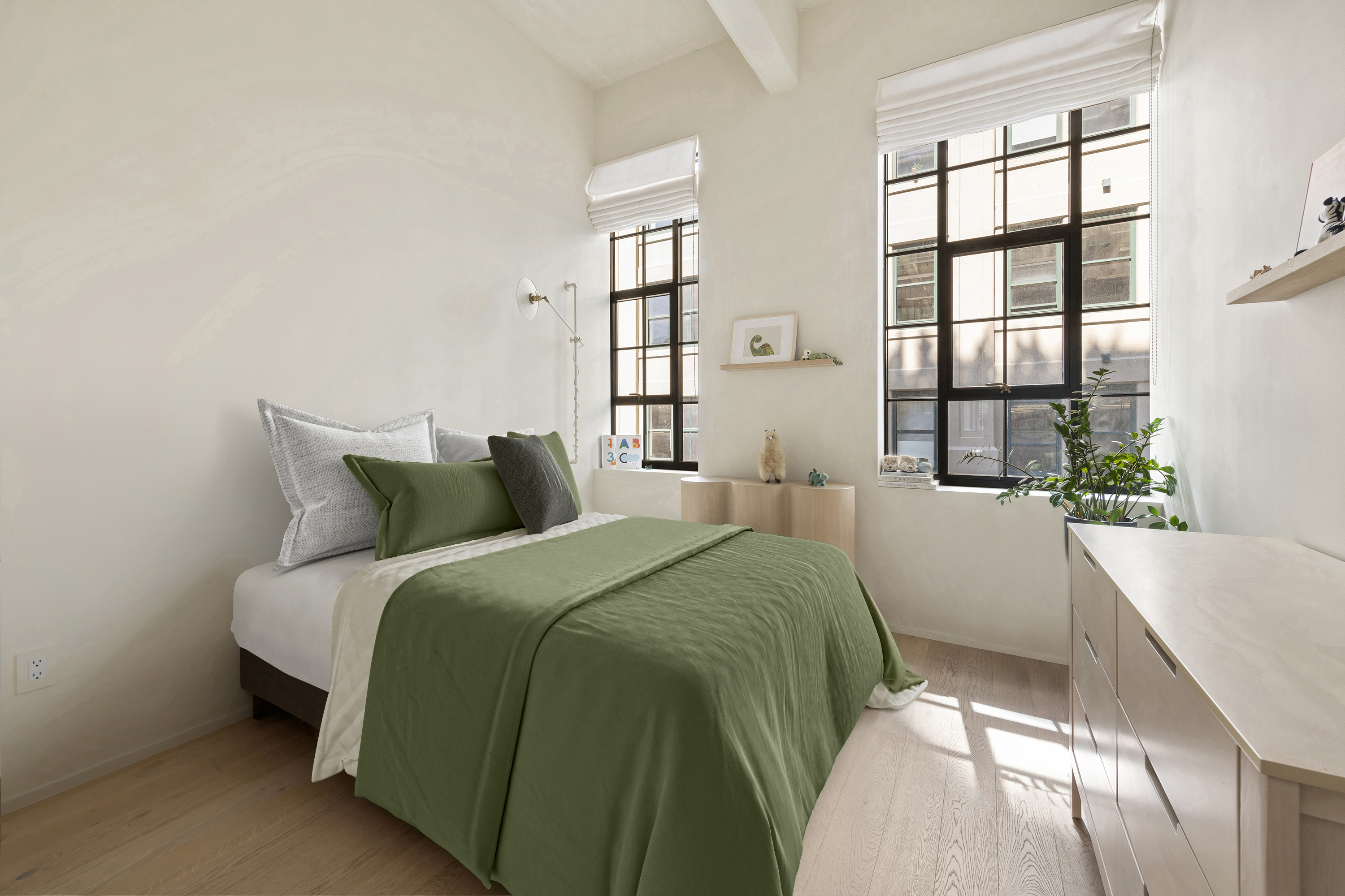 168 Plymouth Street, Unit 5A Brooklyn, NY 11201 - Photo 10 of 19 a bed sitting in a bedroom next to a window