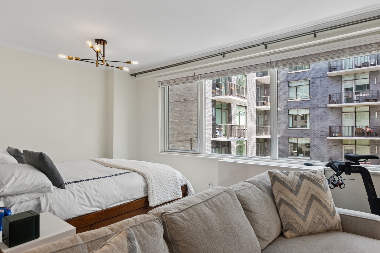 301 East 22nd Street, Unit 11U Manhattan, NY 10010 - Photo 5 of 11 a bedroom with a bed furniture and a window