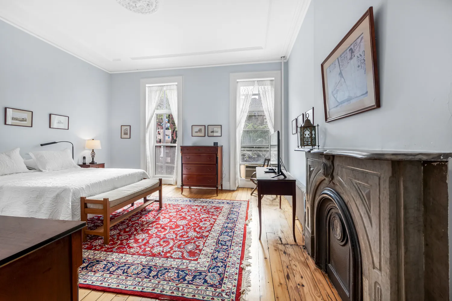 a bed room with a bed and a television