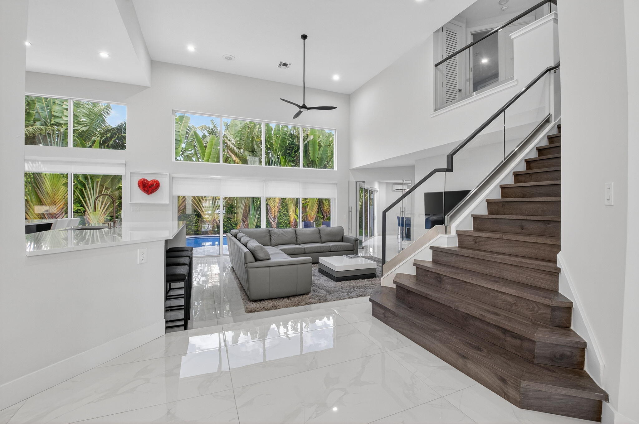 6529 Somerset Circle Boca Raton, FL 33496 - Photo 12 of 75 a living room with furniture and a large window