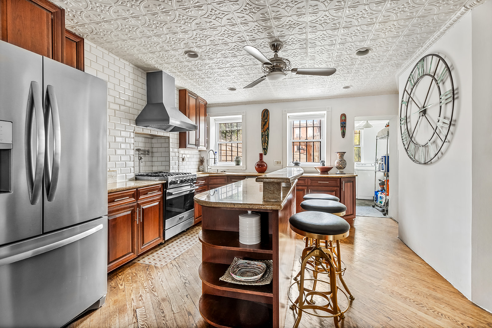 480 A MacDonough Street Brooklyn, NY 11233 - Photo 7 of 10 a kitchen with stainless steel appliances granite countertop a refrigerator a stove and a wooden floors