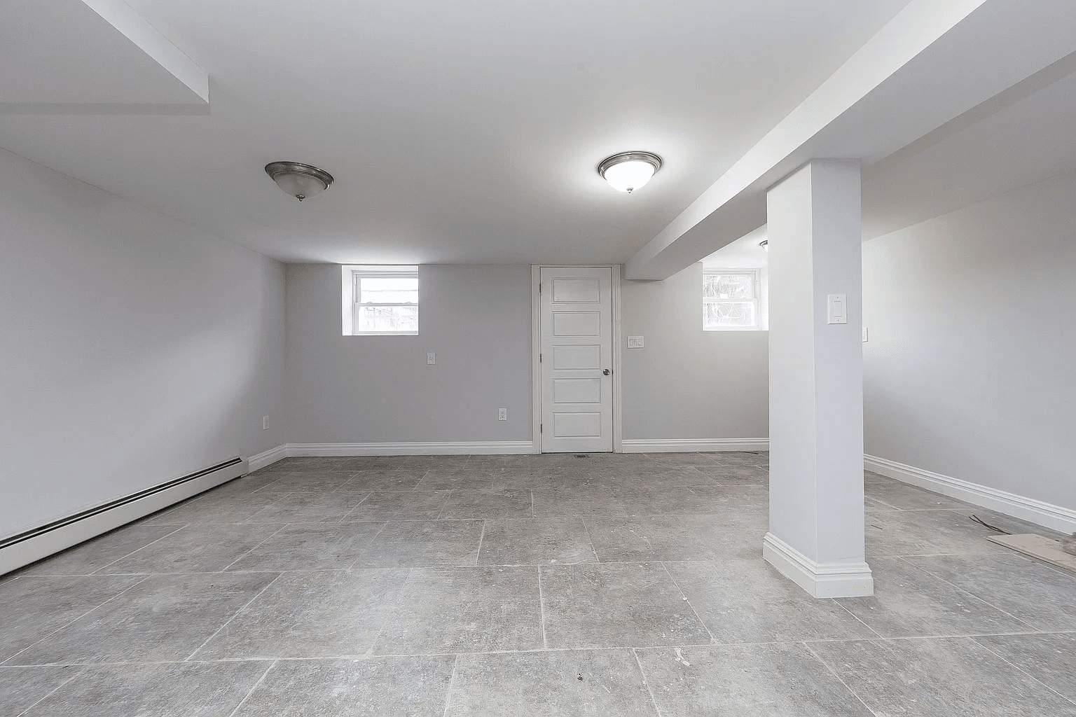 581 Van Siclen Avenue Brooklyn, NY 11207 - Photo 14 of 16 an empty room with windows