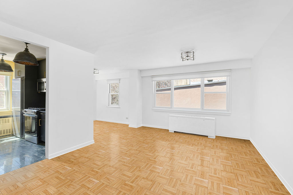 101 West 12th Street, Unit 5V Manhattan, NY 10011 - Photo 20 of 26 a view of empty room with wooden floor