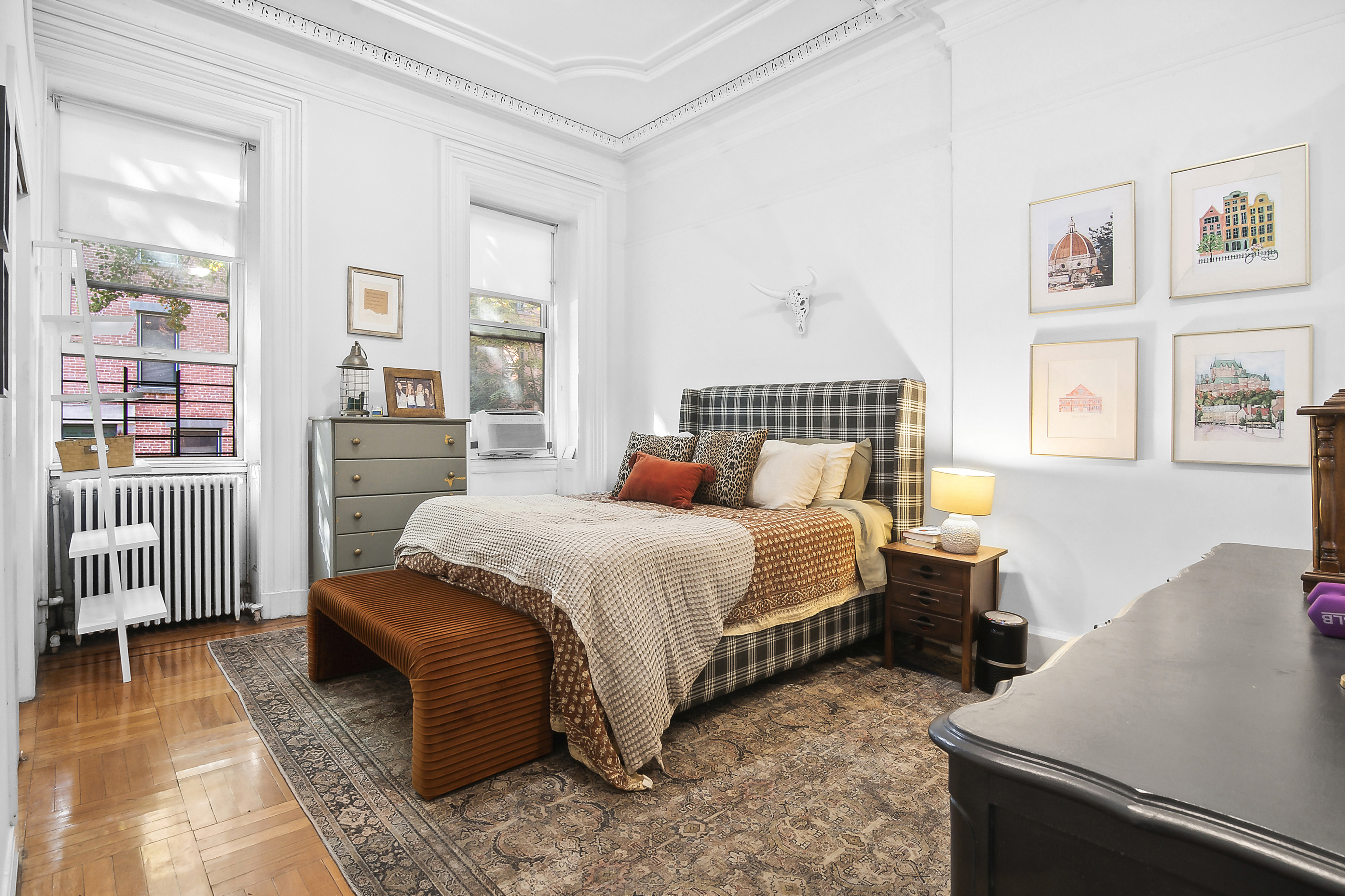 245 Baltic Street, Unit 1 Brooklyn, NY 11201 - Photo 2 of 7 a bedroom with a bed and wooden floor