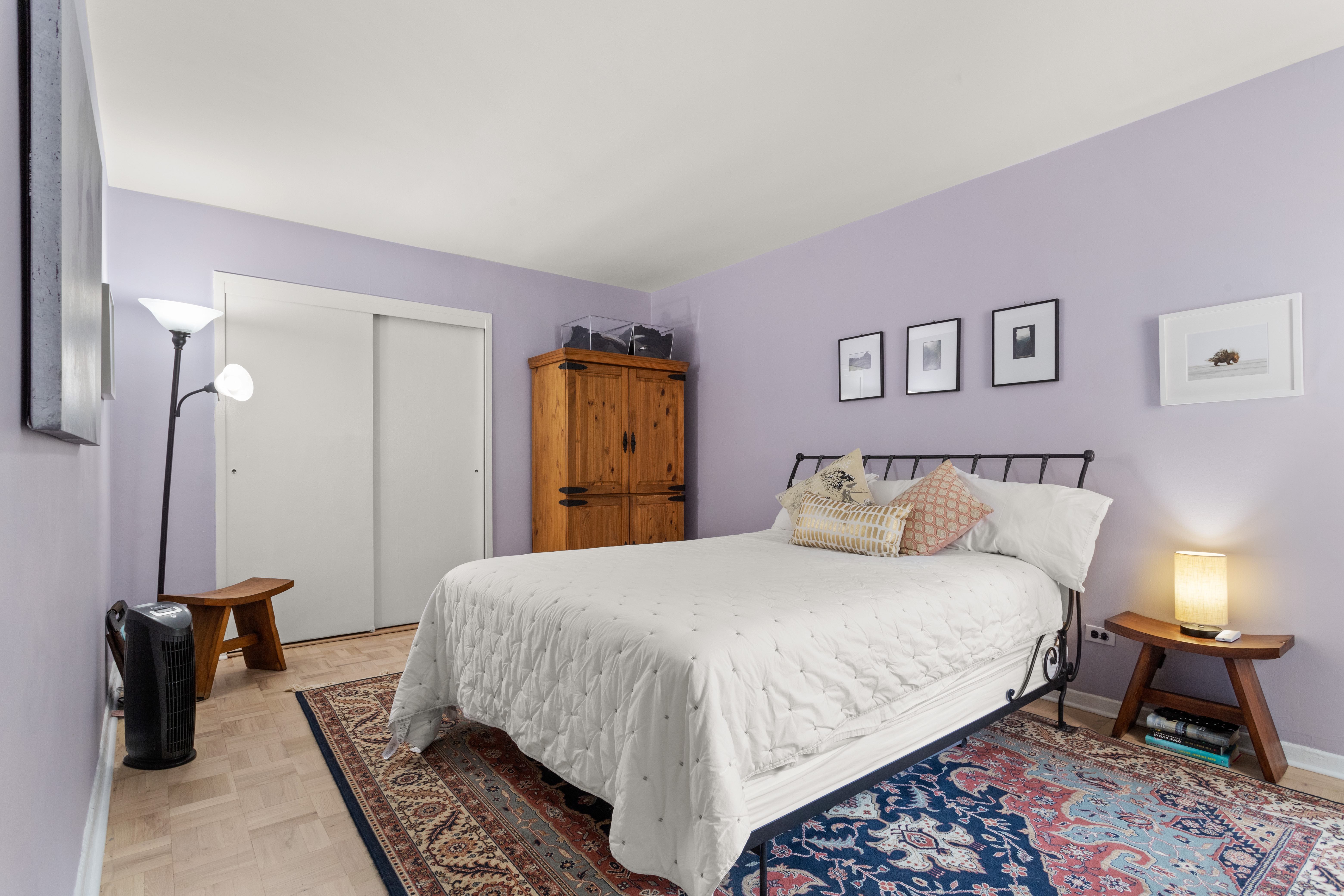 66 Overlook Terrace, Unit 4K Manhattan, NY 10040 - Photo 11 of 26 a bedroom with a bed and a couch