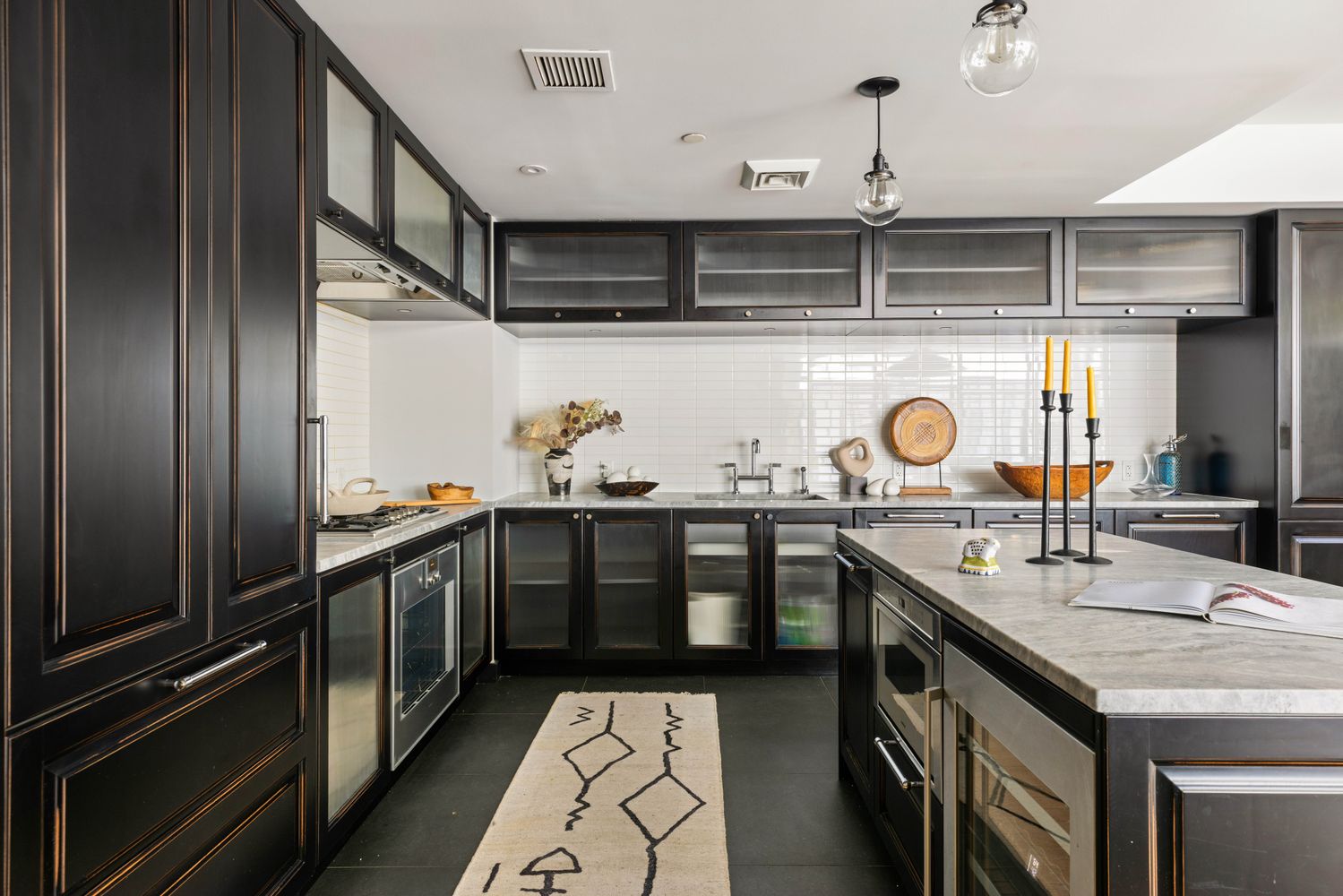 a kitchen with stainless steel appliances granite countertop a sink and cabinets