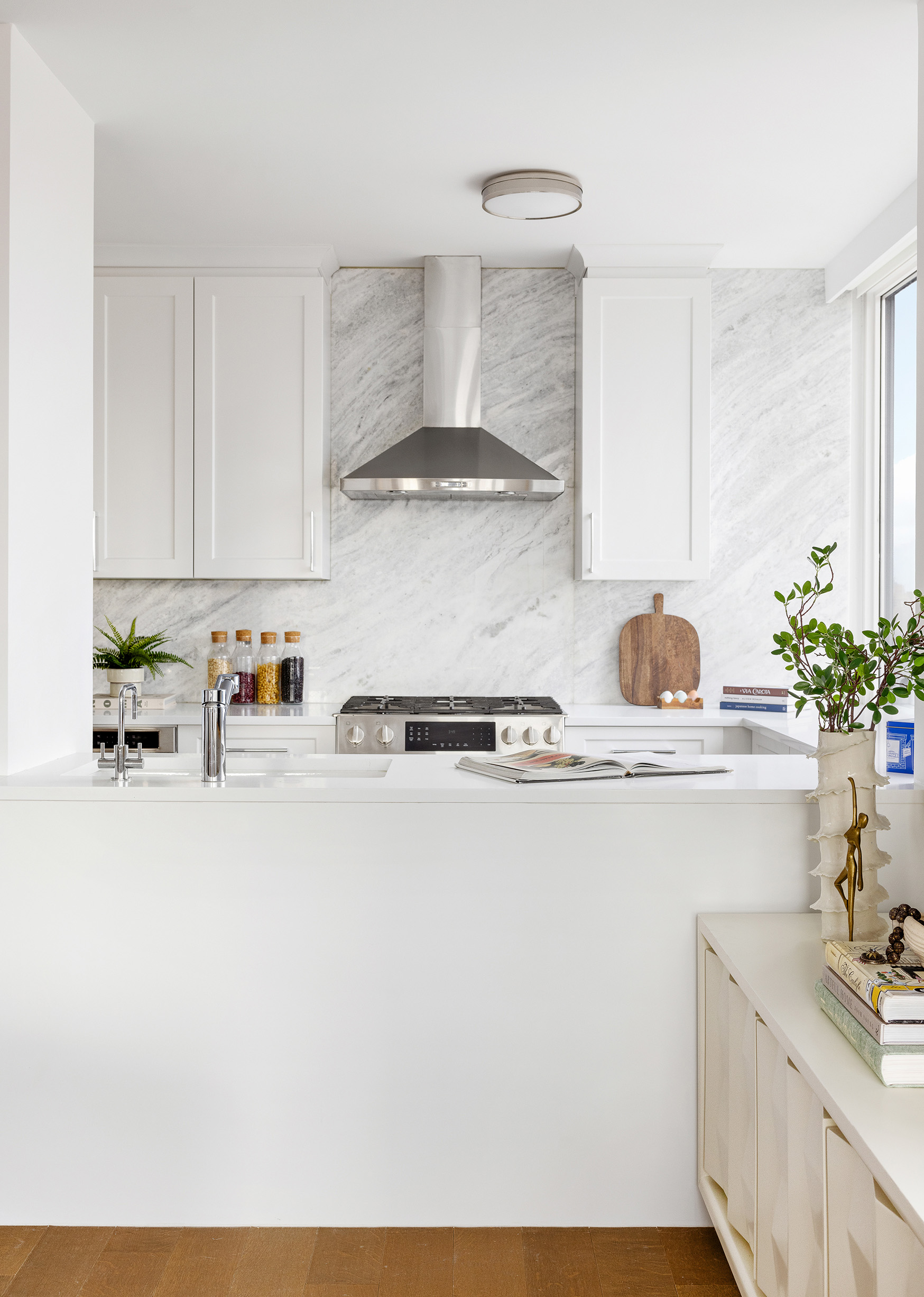 455 East 86th Street, Unit 20E Manhattan, NY 10028 - Photo 5 of 14 a kitchen with a sink a stove and cabinets
