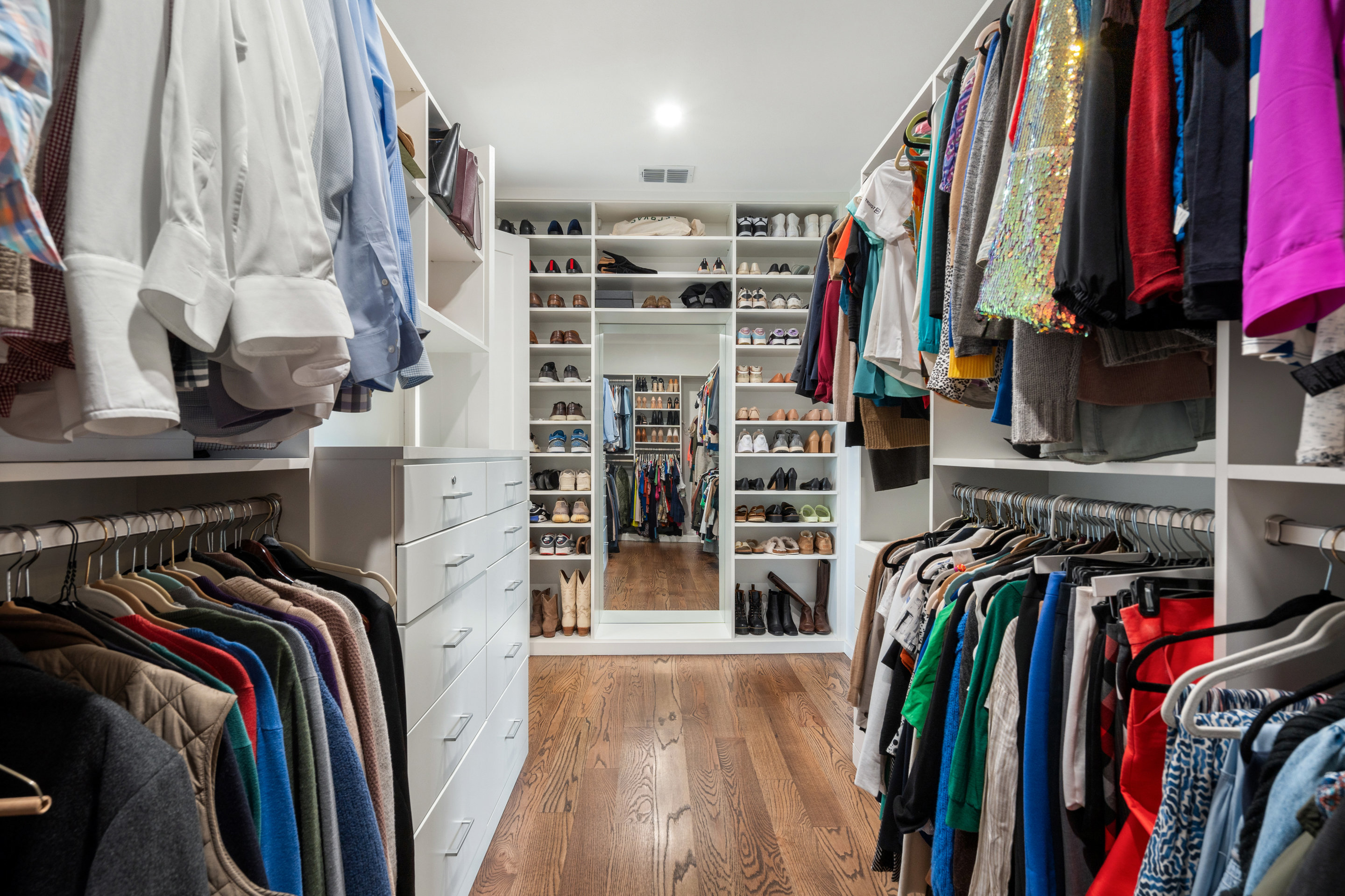 5319 Backtrail Drive Austin, TX 78731 - Photo 25 of 35 a view of walk in closet with clothes and shoes