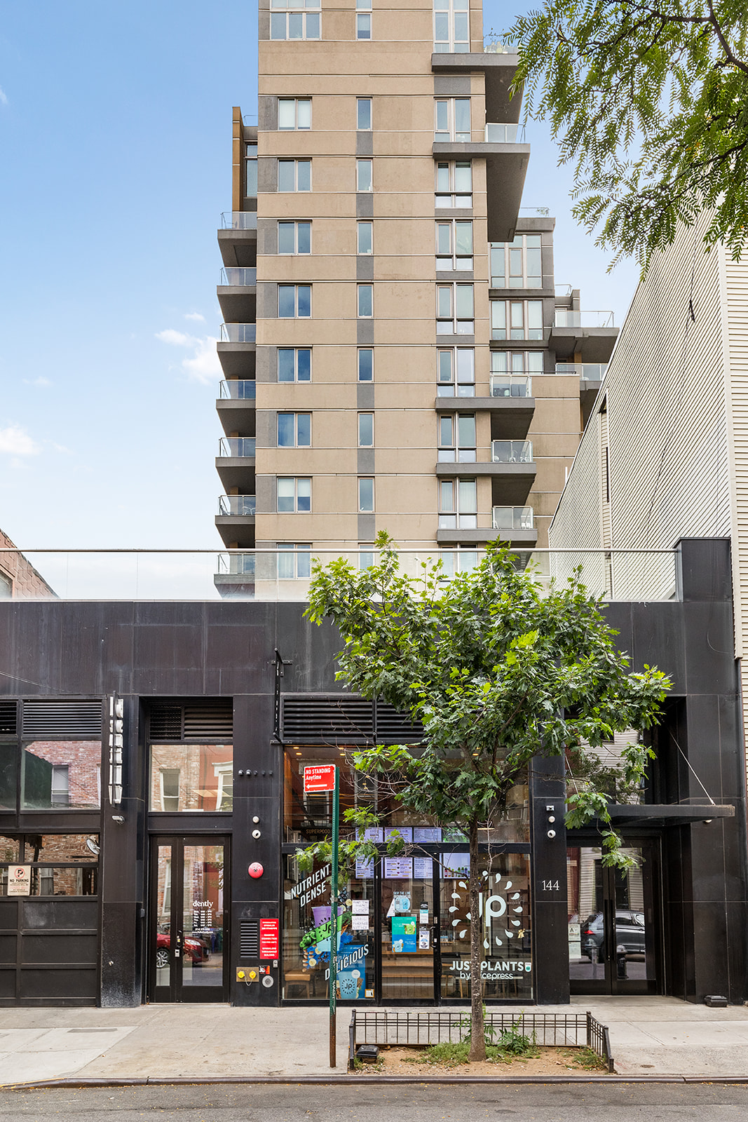 144 North 8th Street, Unit 8C Brooklyn, NY 11249 - Photo 12 of 13 a front view of a building with street view