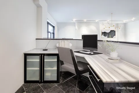 a view of a workspace with furniture
