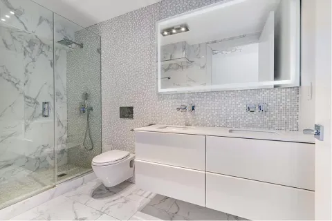 a bathroom with a sink toilet and shower